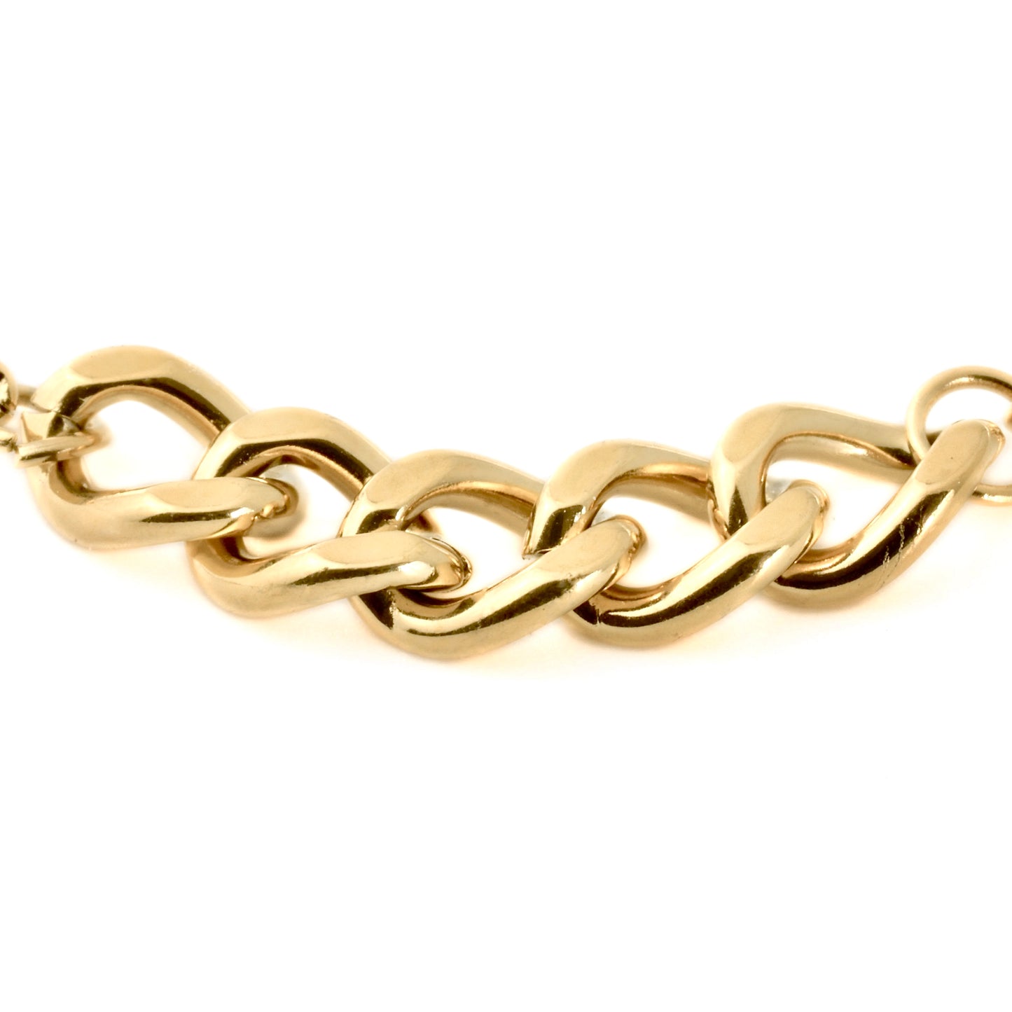 Close-up view of gold chain links in 5mm on a white background
