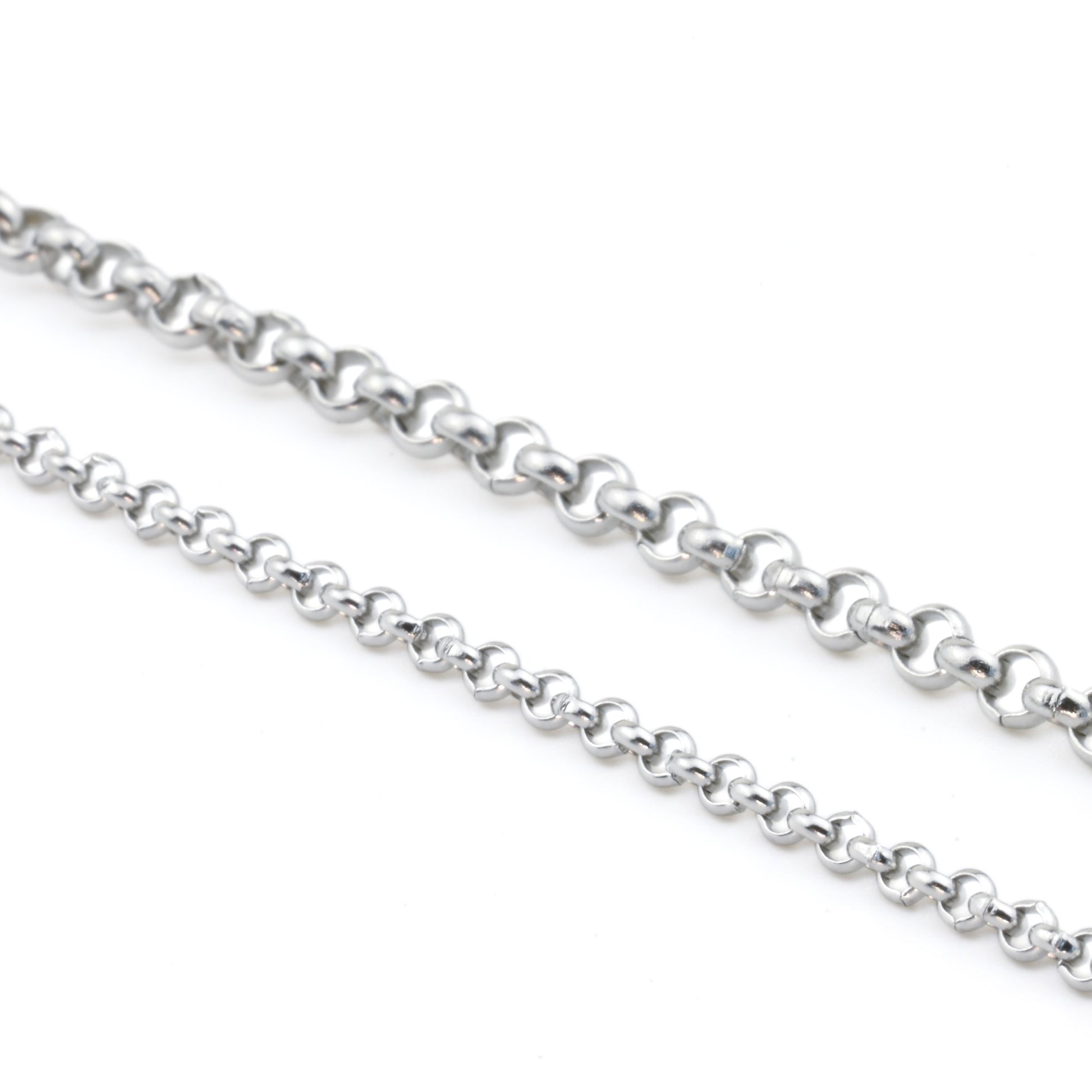 One thin and one thicker silver rolo chains on a white background