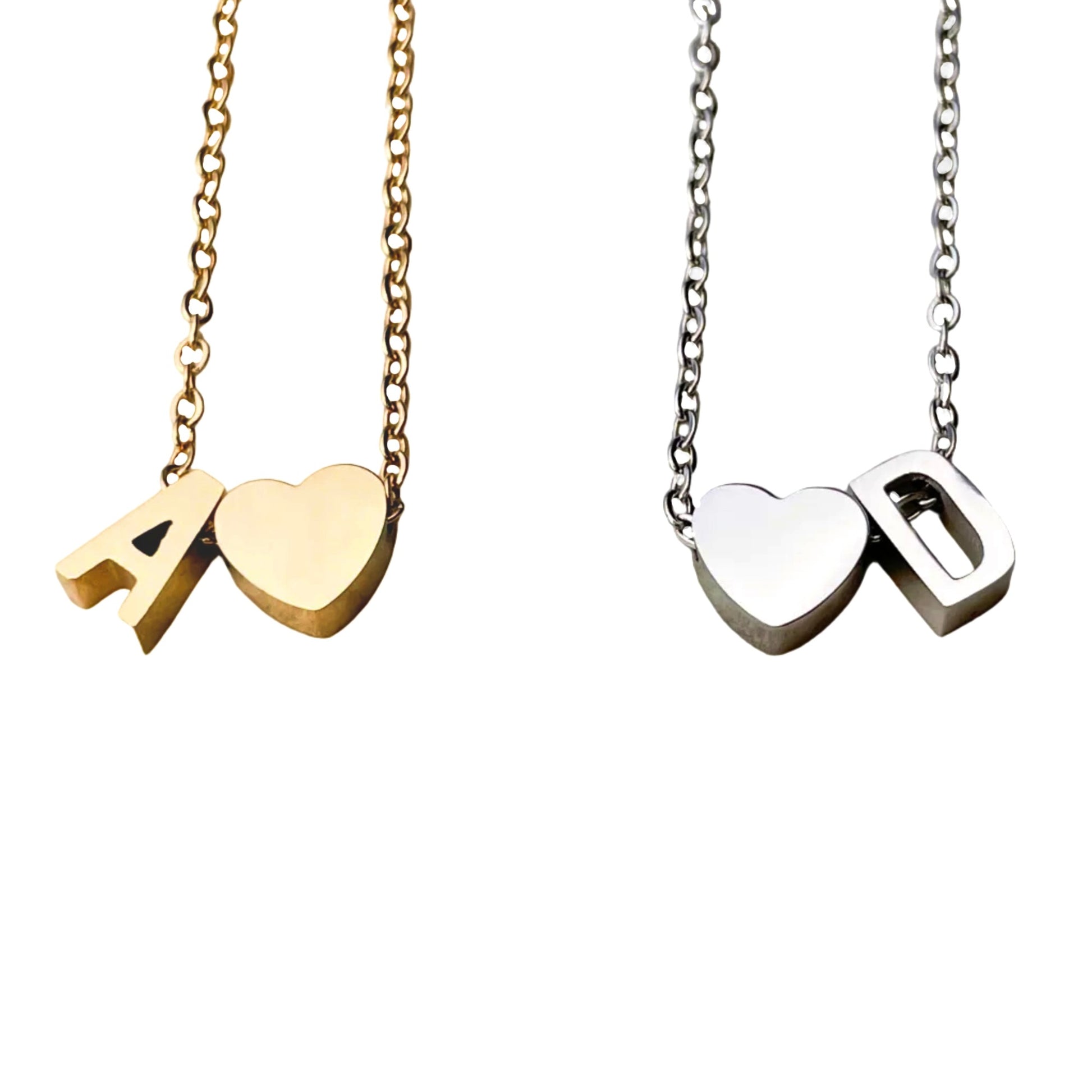 Two necklaces with heart and letter pendants on gold and silver cable chains.