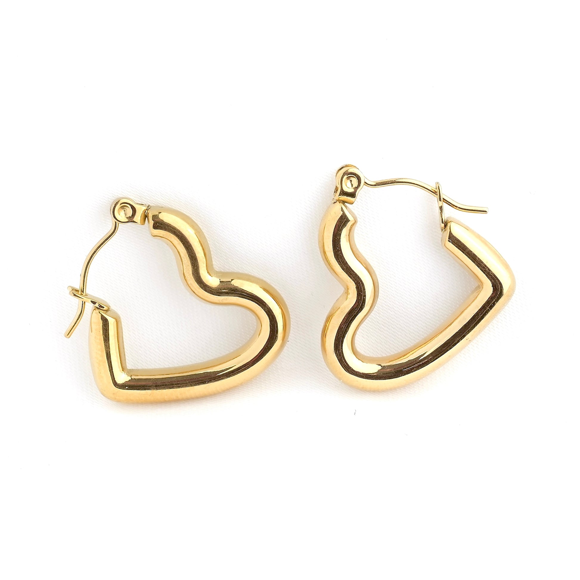 Chunky Gold hoop earrings on a white background