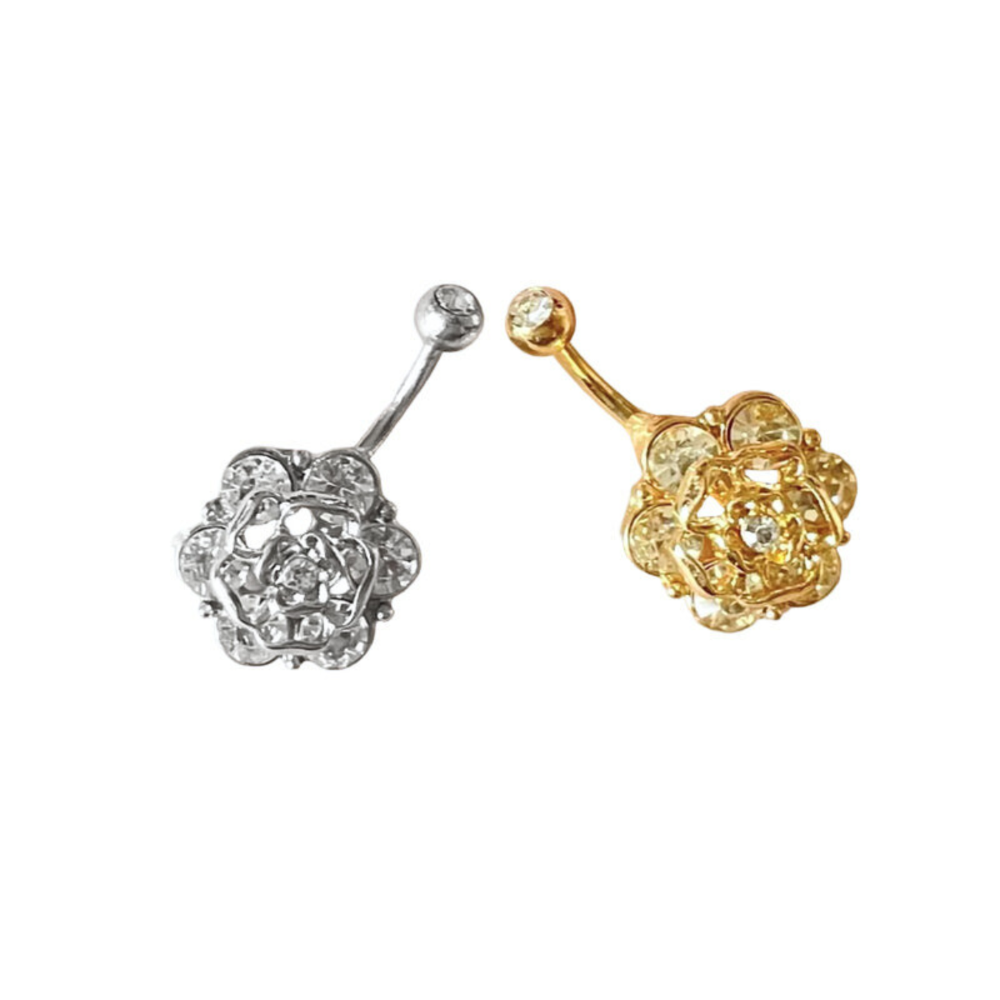 Gold and silver belly button rings with rose designs on a white background