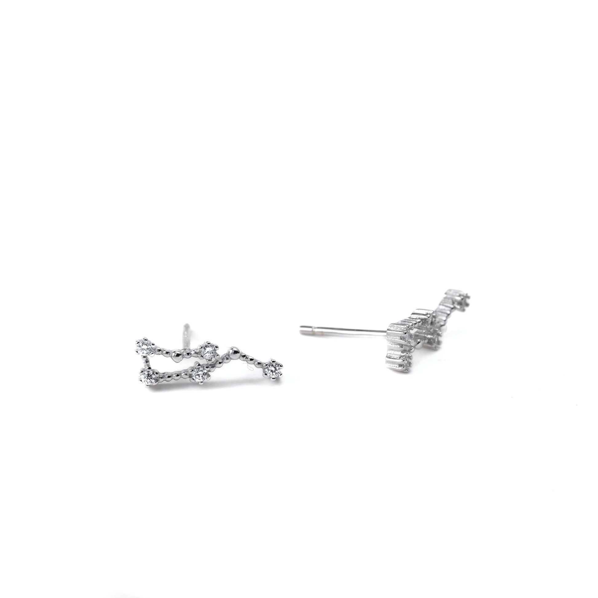 Silver constellation earrings on a white background