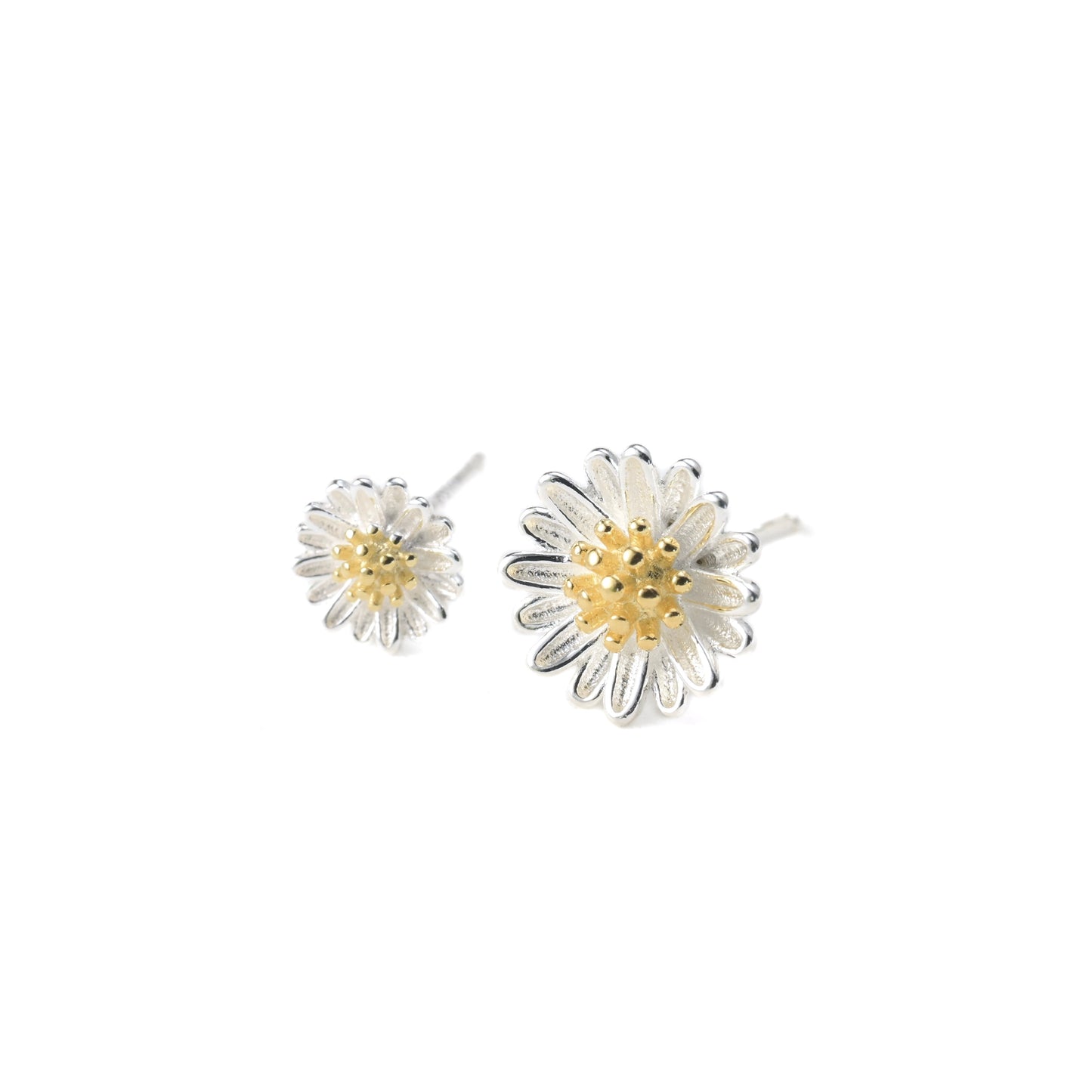 One small and one medium sized daisy-shaped earrings on a white background