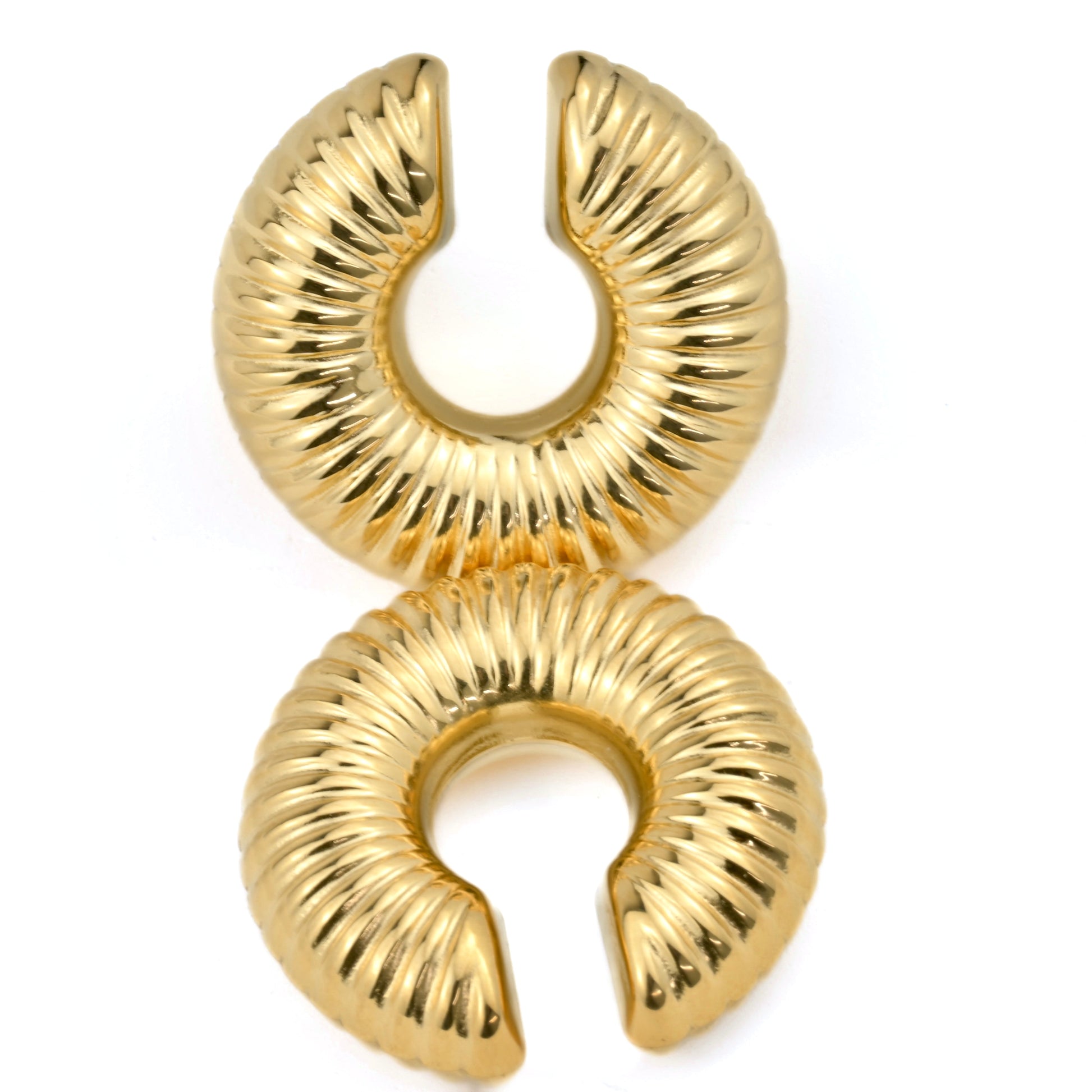 Pair of ribbed hoop cuff earrings on a white background