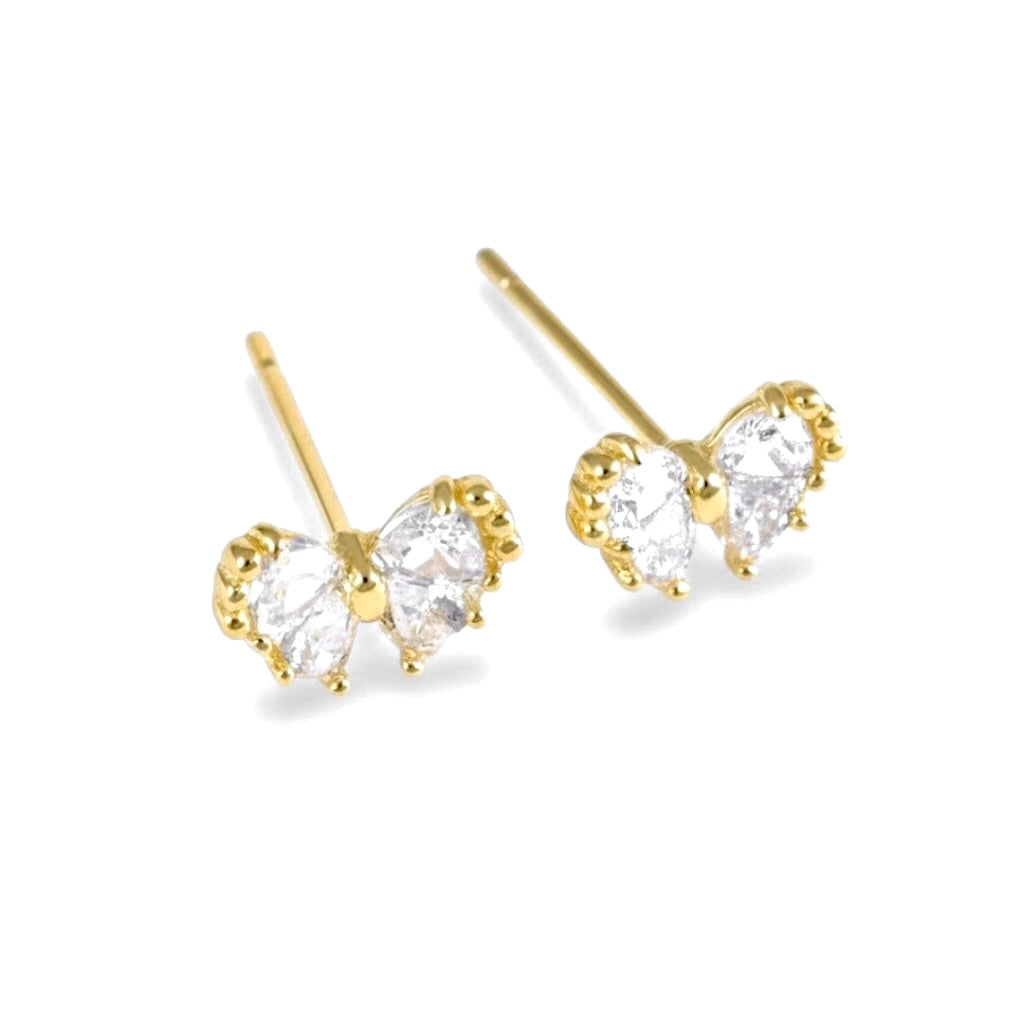 A pair of gold butterfly earrings featuring four clear trillion-cut stones in a prong setting, shown on a clean white background.
