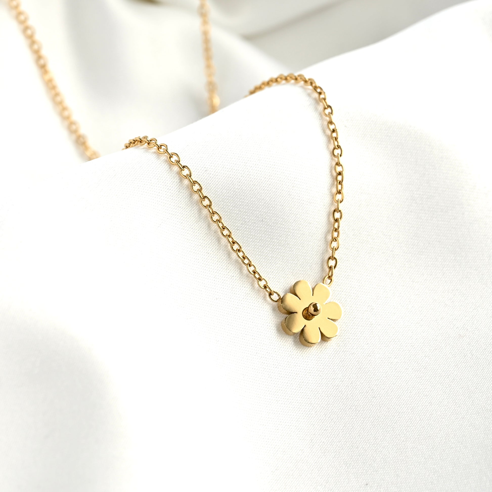 Gold flower necklace  on a white background