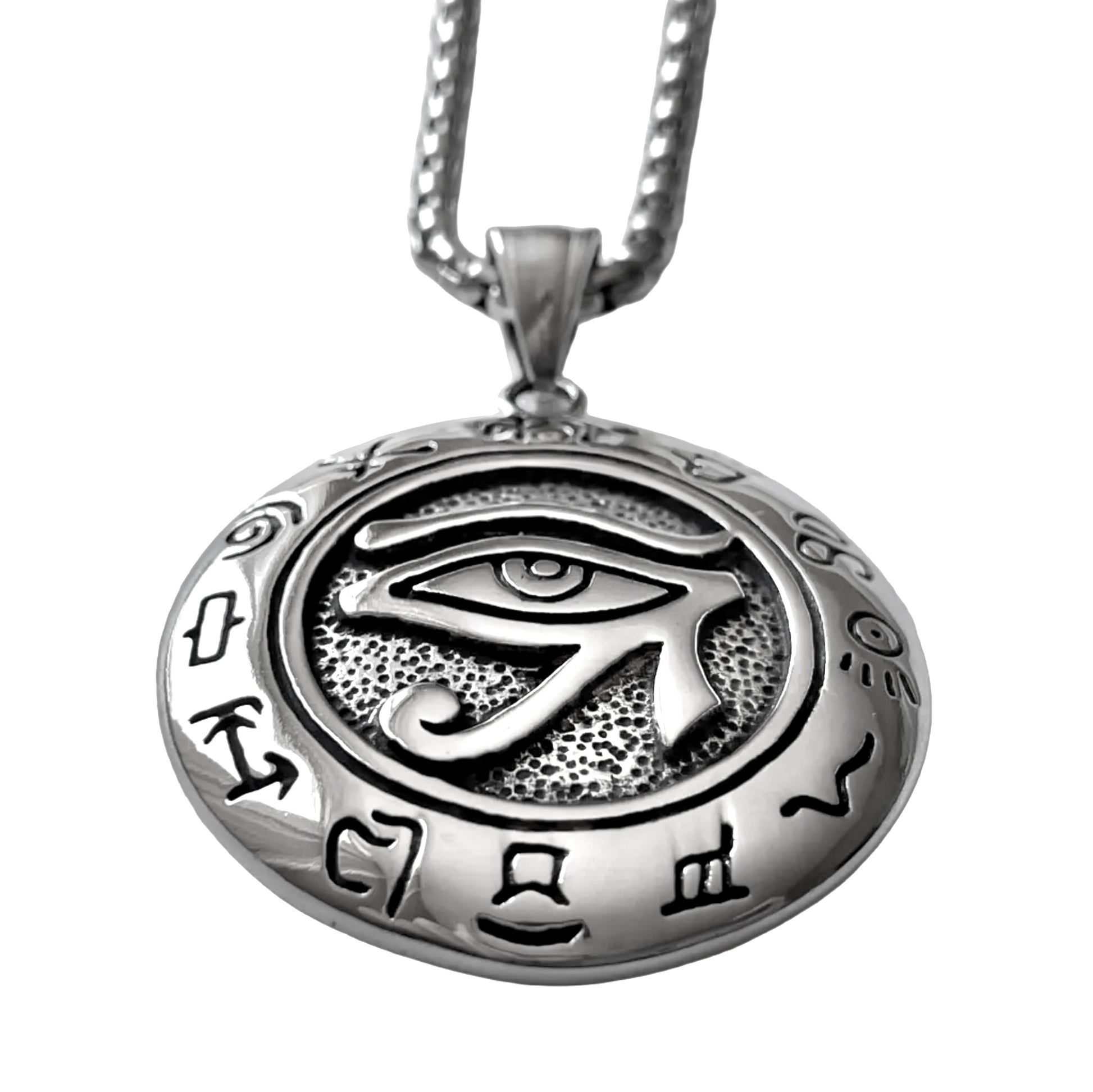 Silver pendant with eye symbol and hieroglyphs on a white background