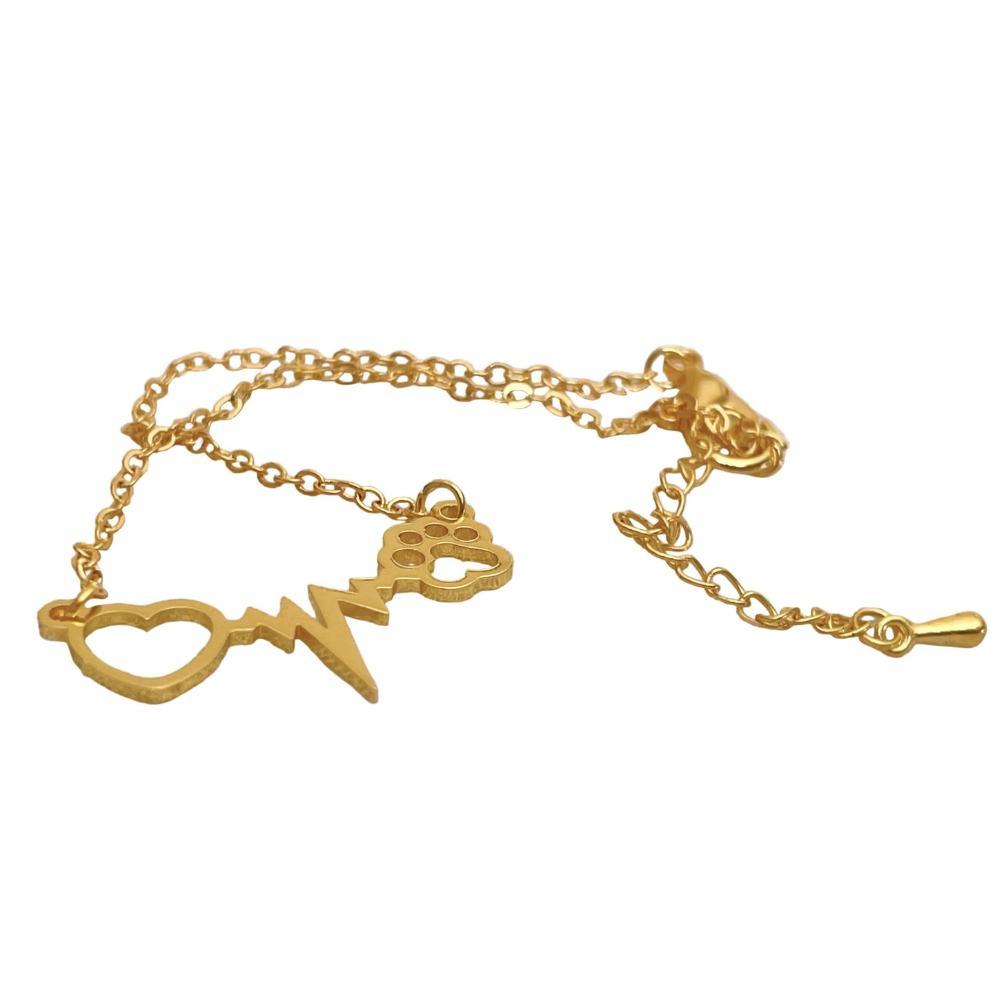 Gold bracelet with paw print and heart charm design on a white background