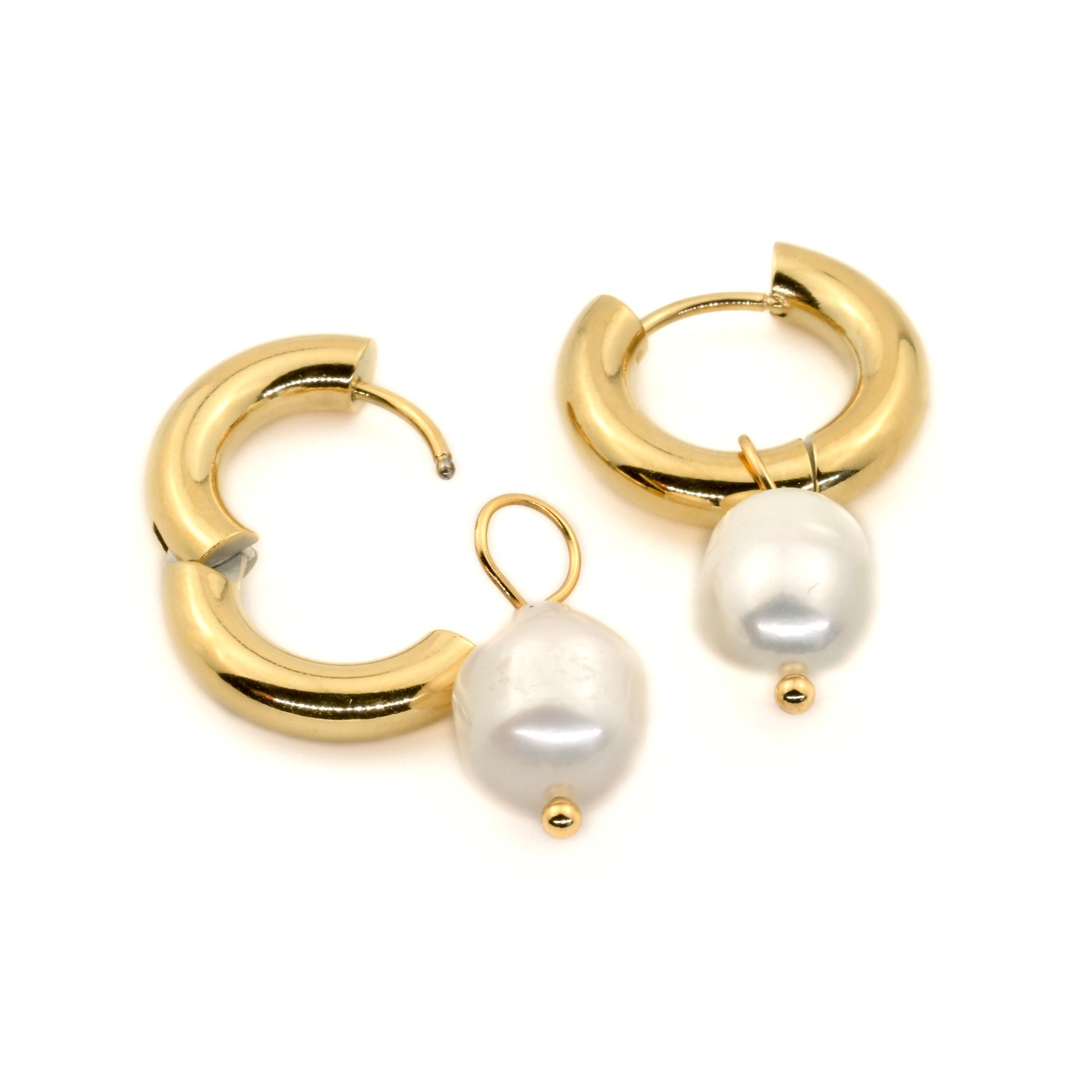 Close up view of gold hoop earrings with white pearls, one open and one closed, on a white background