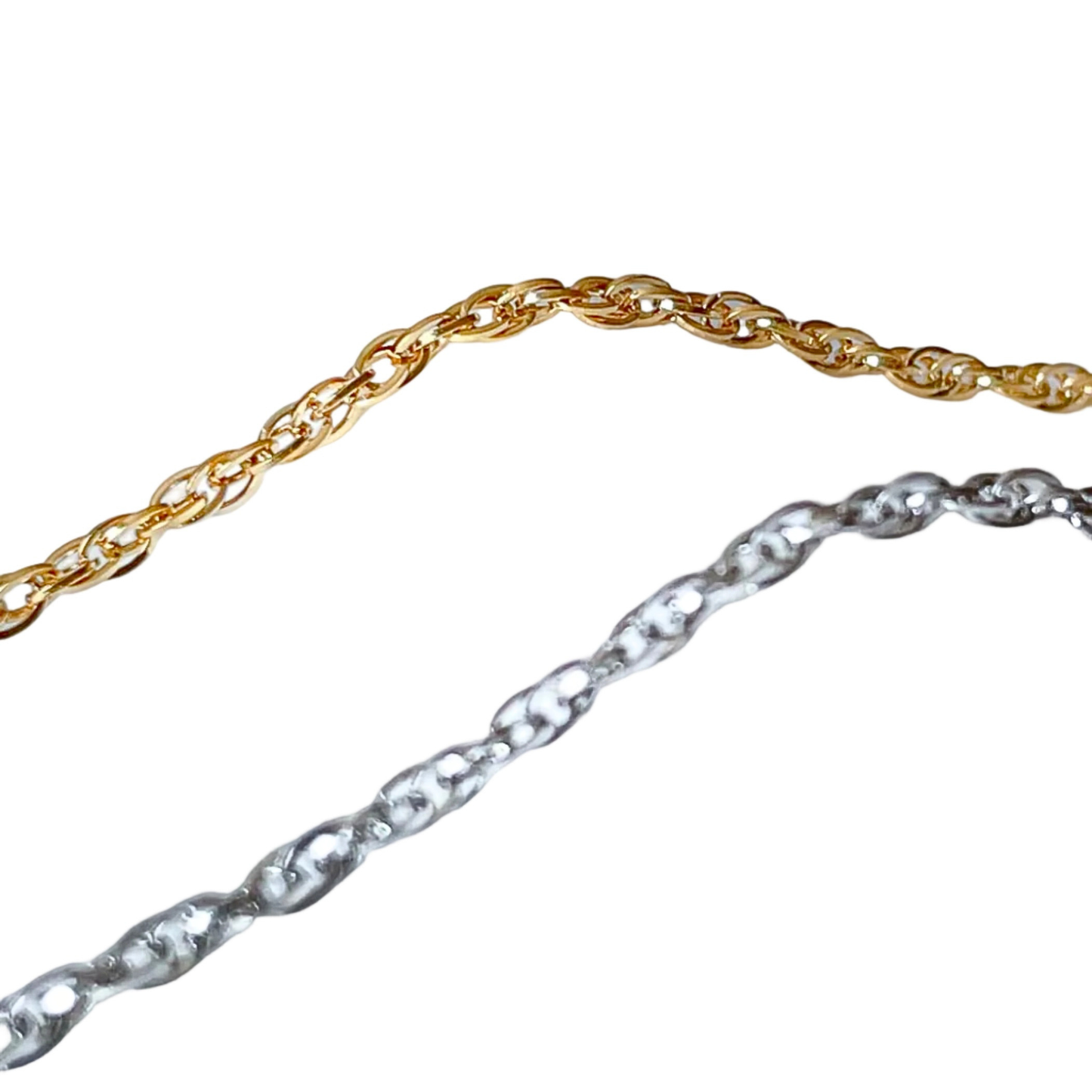 Gold and silver twist chain ankle bracelets on a white background
