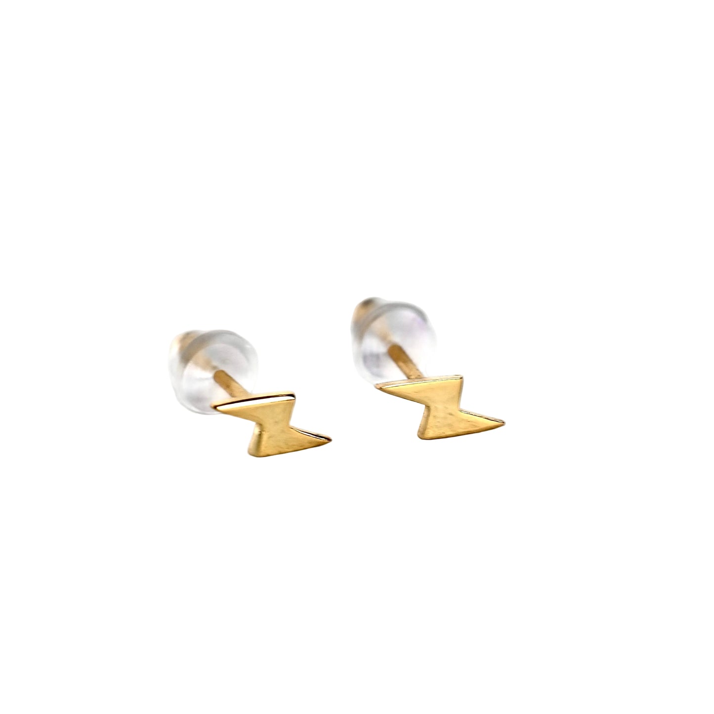 Front view of gold lightning bolt earrings with silicone backs on a white background