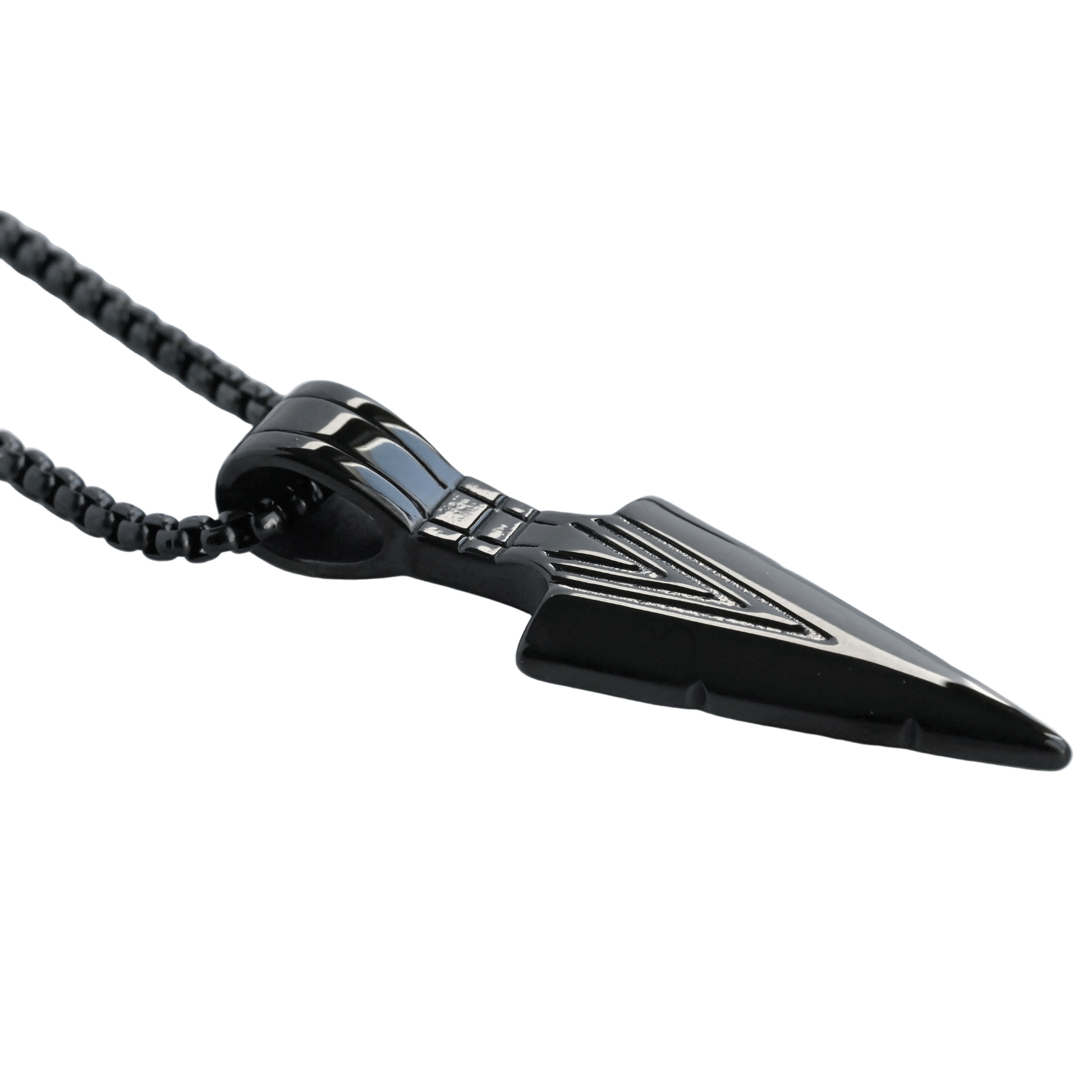Black arrowhead pendant on a chain against a white background