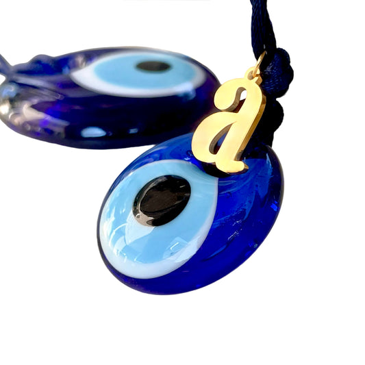 Glass teardrop evil eye talisman with a navy rope and lower case stainless steel initial 'A'