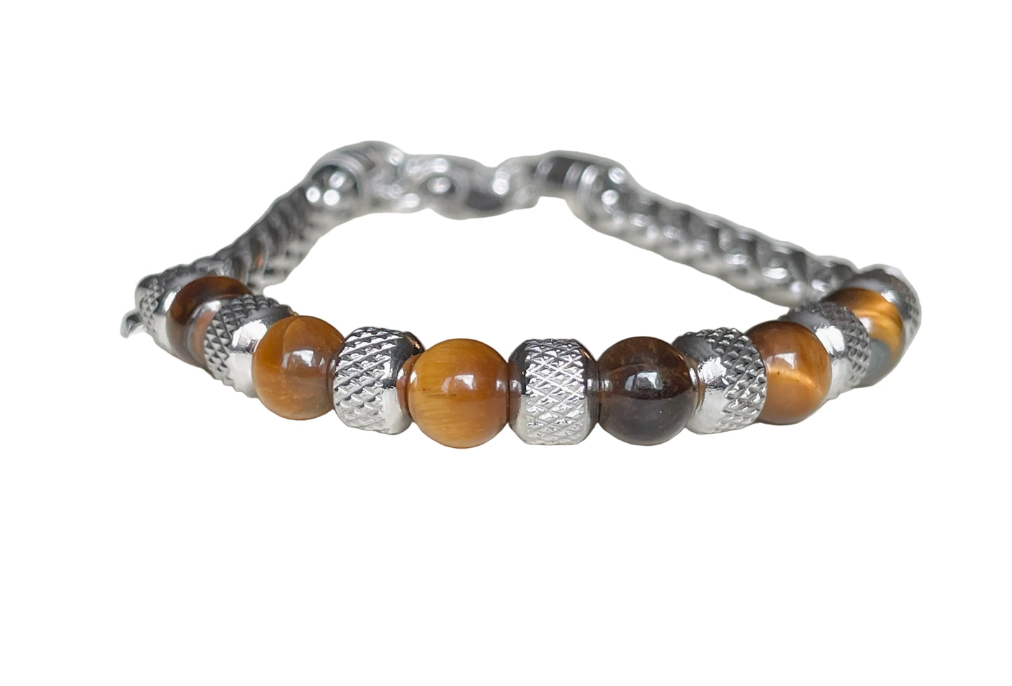 Close-up view of tiger eye stones on a silver bracelet on a light background