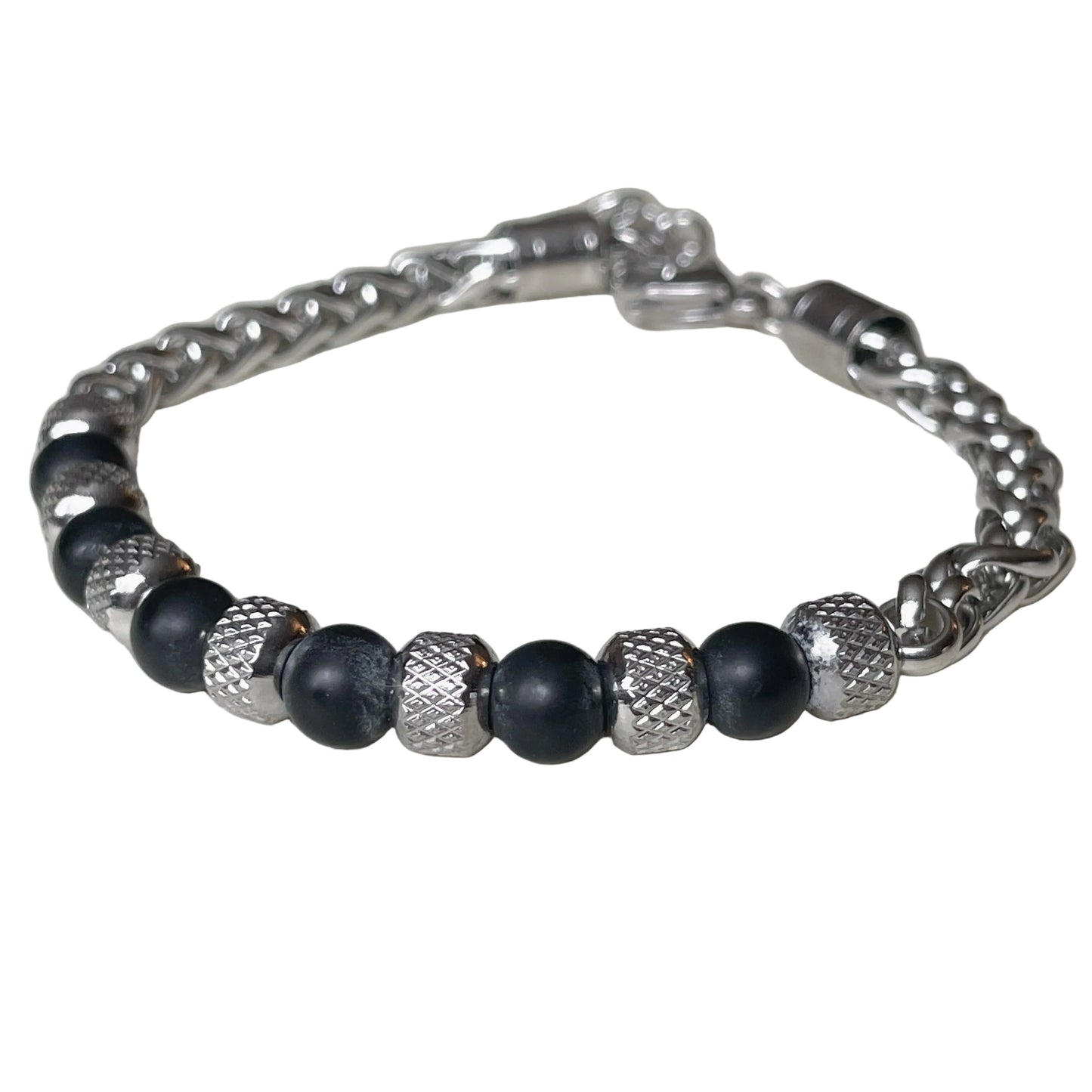 Silver chain bracelet with black beads and silver metal links on a white background