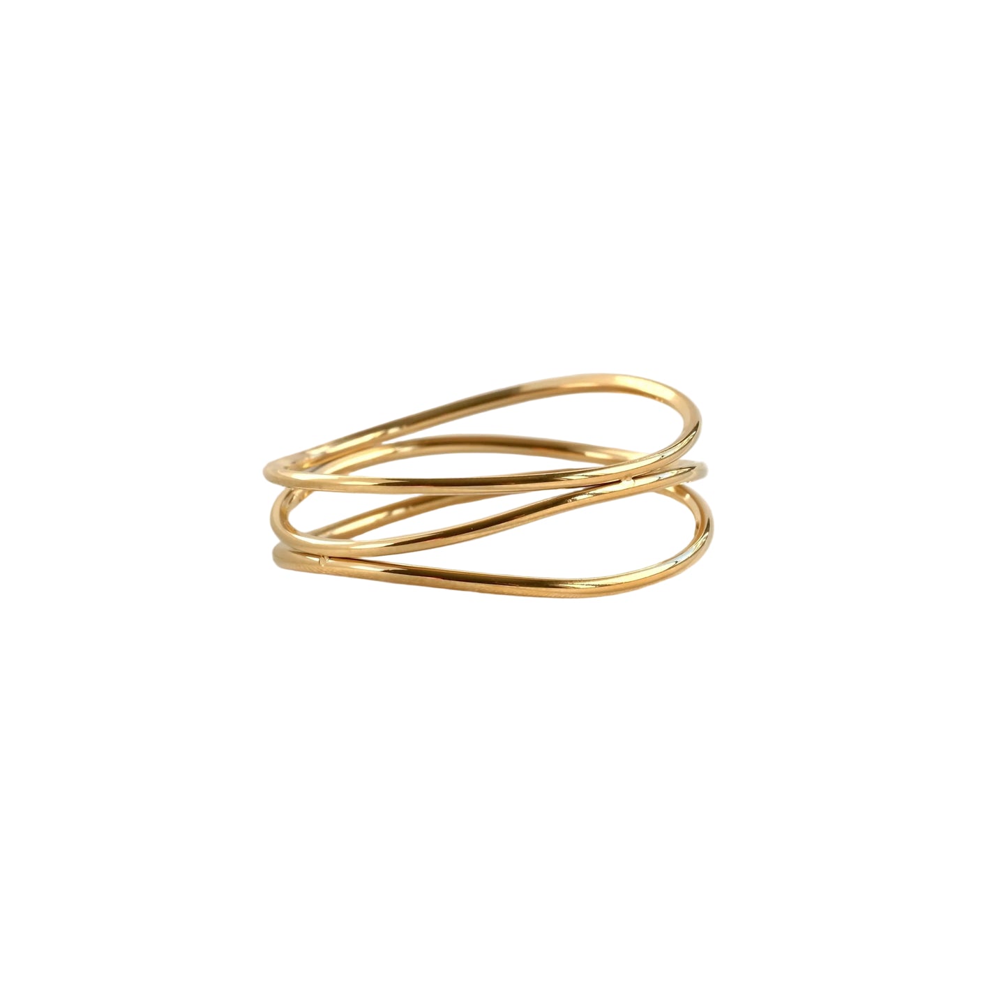 Multi-band gold ring on a pure  white fabric background