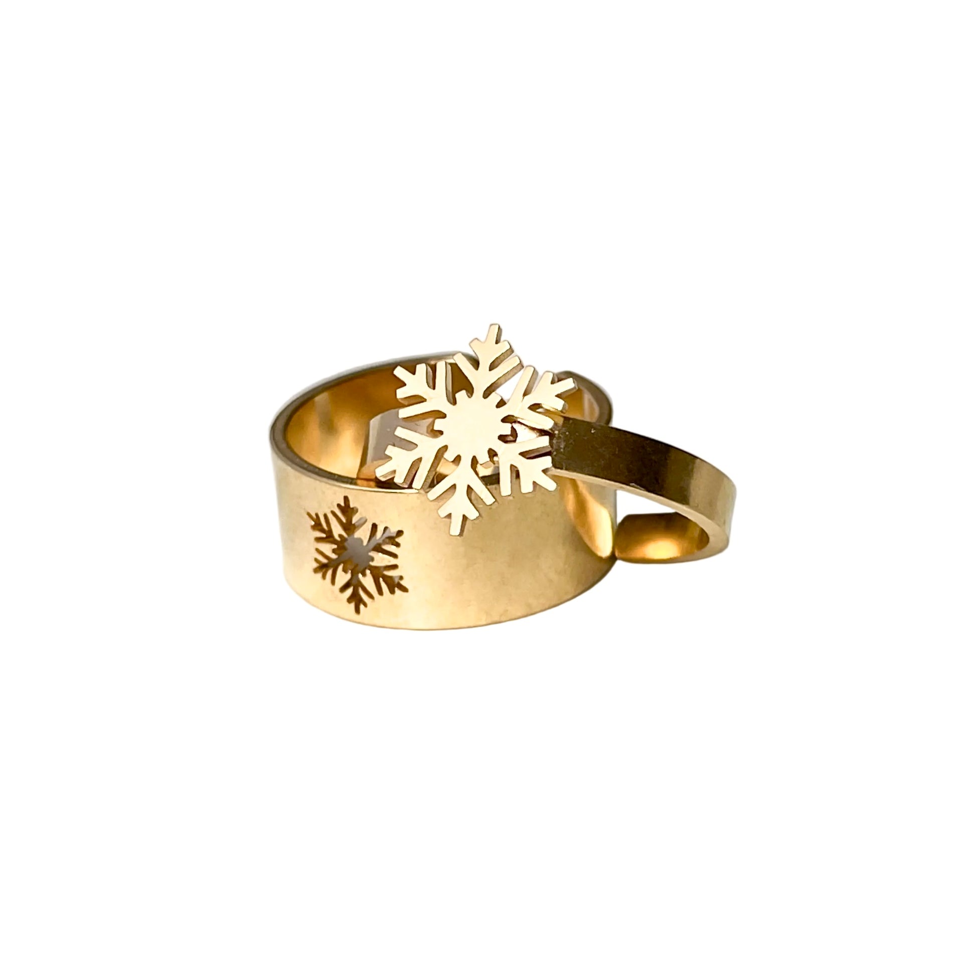 Gold snowflake ring set with snowflake designs on a white background