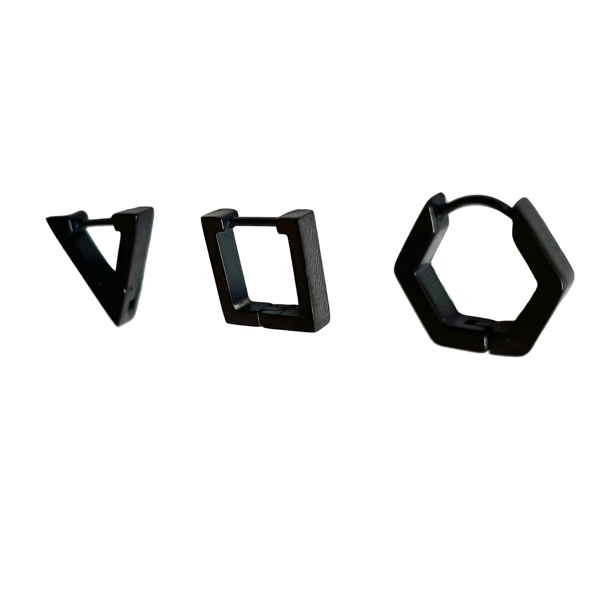 Three pairs of black hoop earrings on a white background