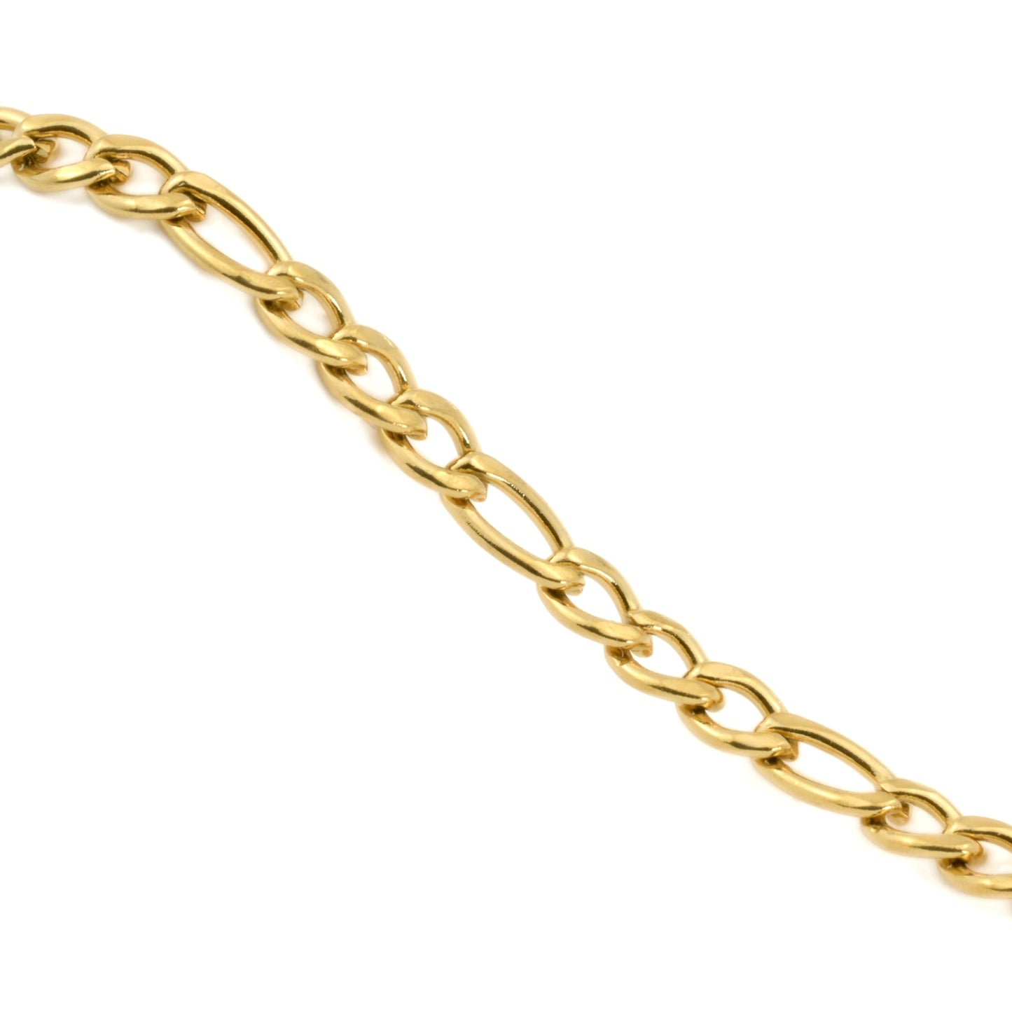 Dainty gold figaro necklace on a white background