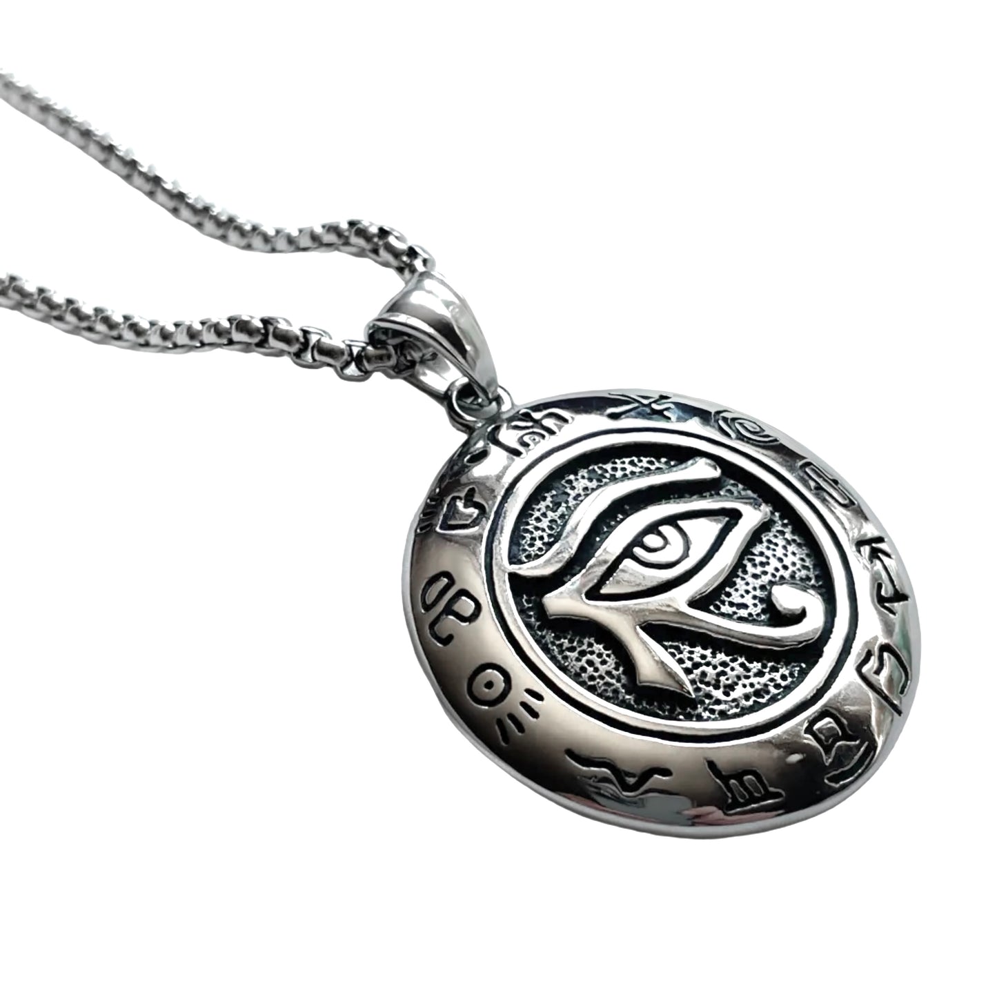 Silver evil eye medallion necklace on a white background