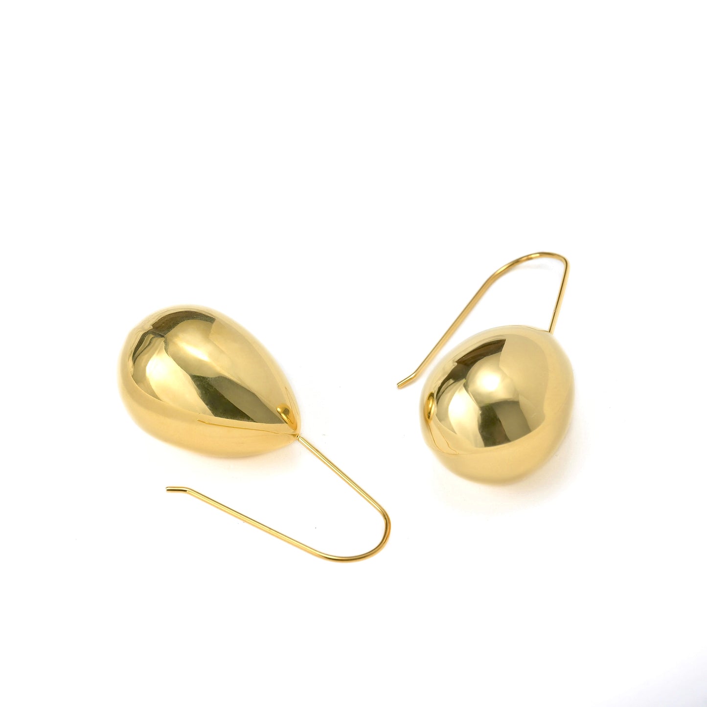 Gold earrings on a white background