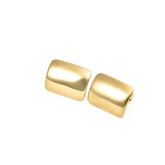 A pair of gold-toned rectangular stud earrings with rounded corners, displayed on a clean white background.