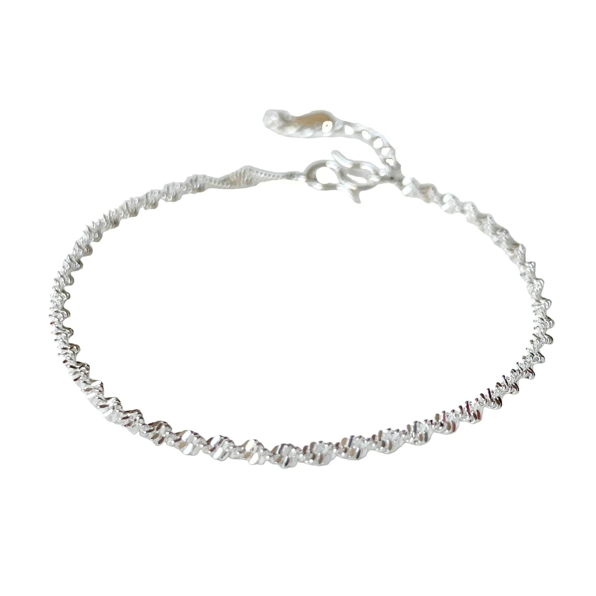 Silver chain bracelet on a white background