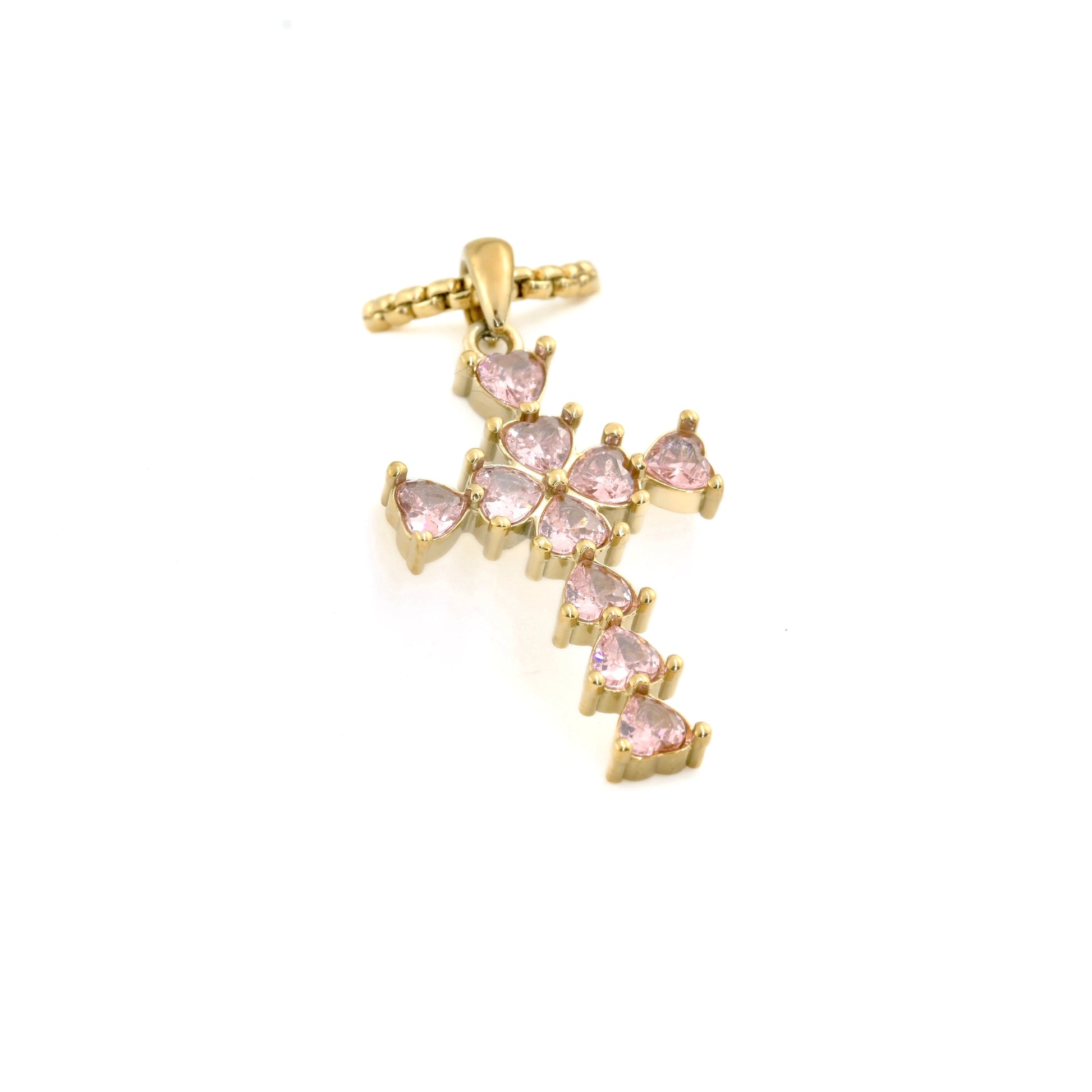 Gold cross pendant with pink CZ on a white background