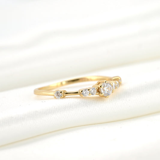 Gold ring with diamonds on a white background