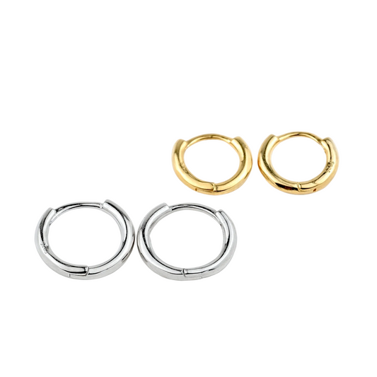 Two pairs of hoop earrings, one gold and one silver, on a white background.