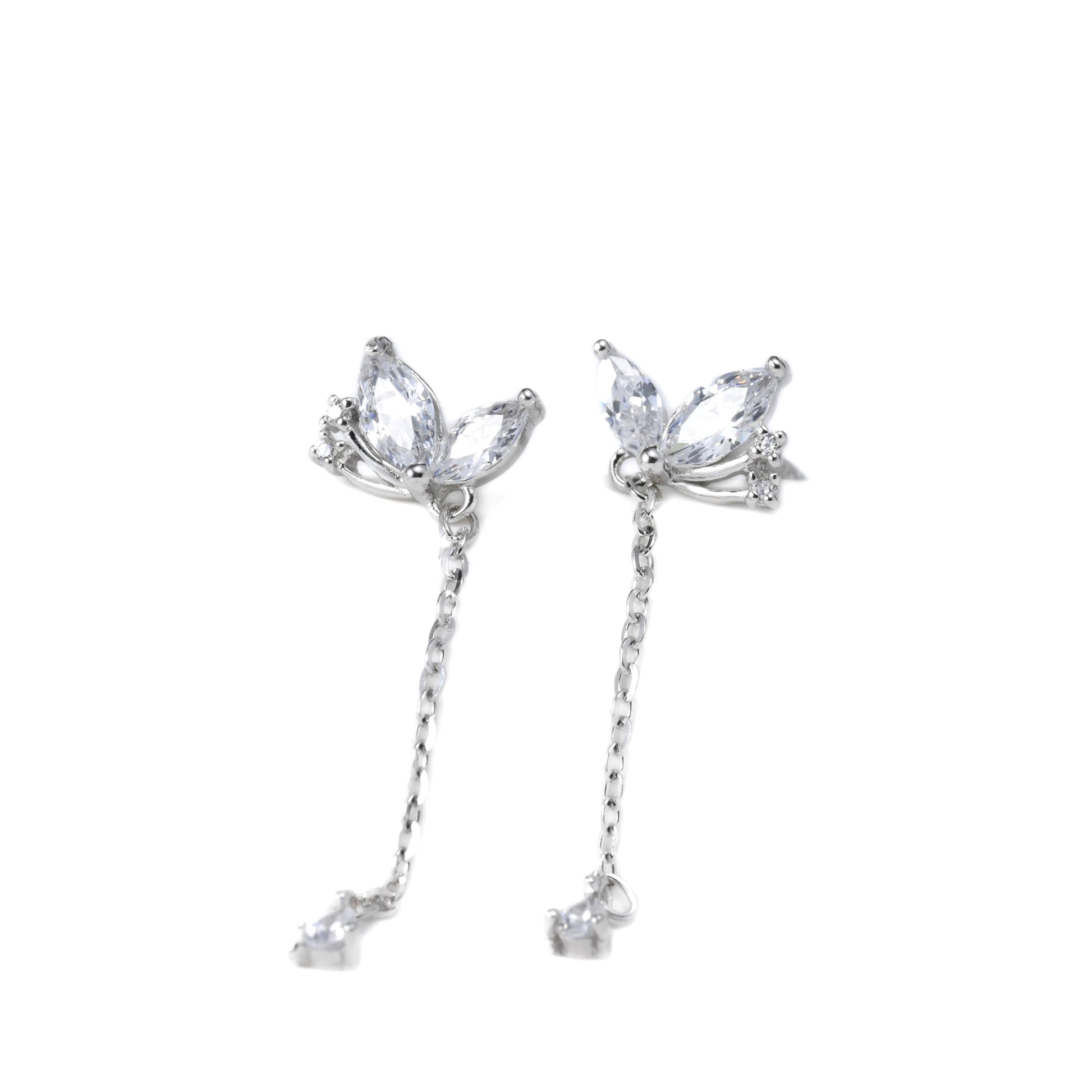Pair of silver marquise earrings with clear gemstones on a white background