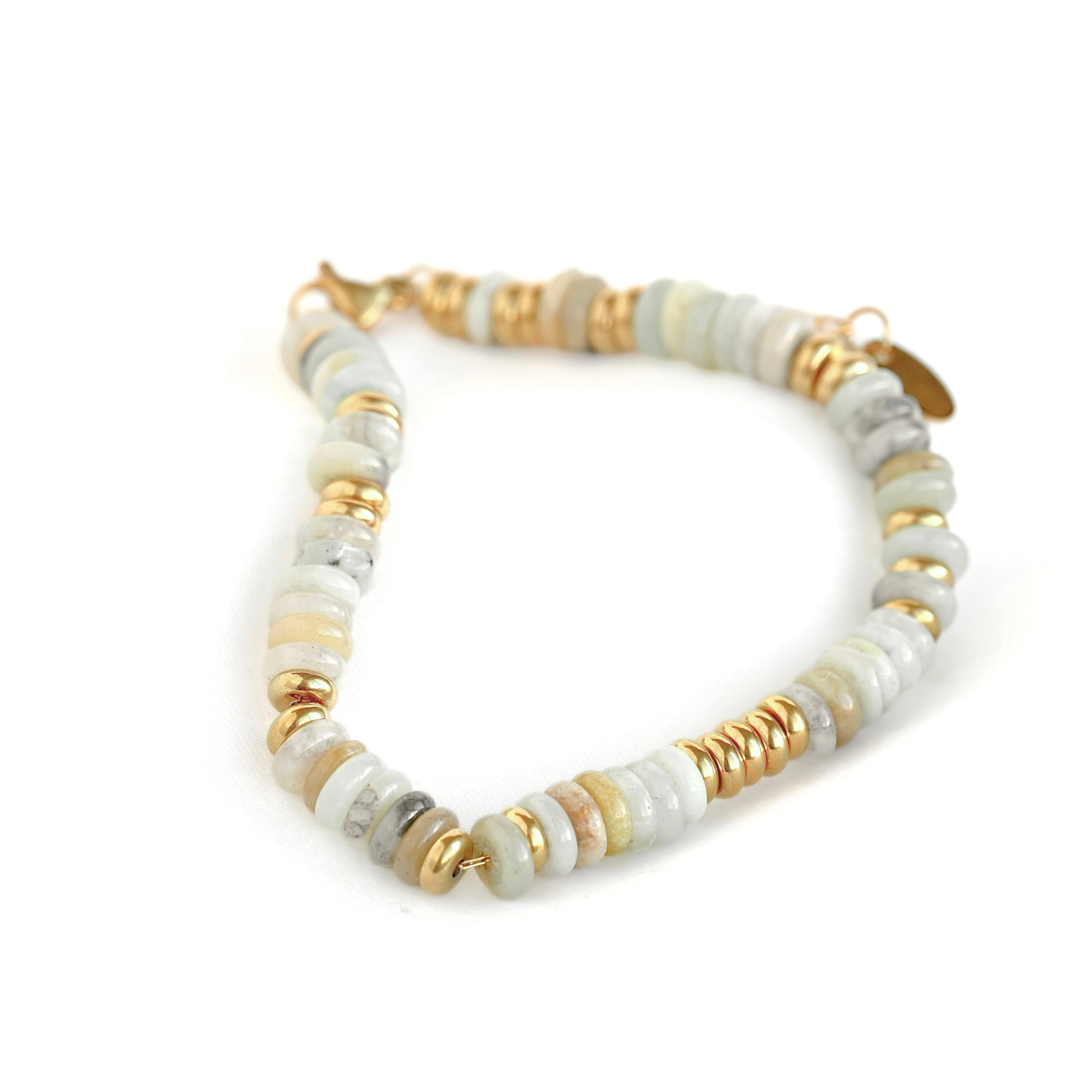 A beaded bracelet featuring light gray and sage stone beads with polished gold spacer beads and a gold clasp, displayed on a clean white background.