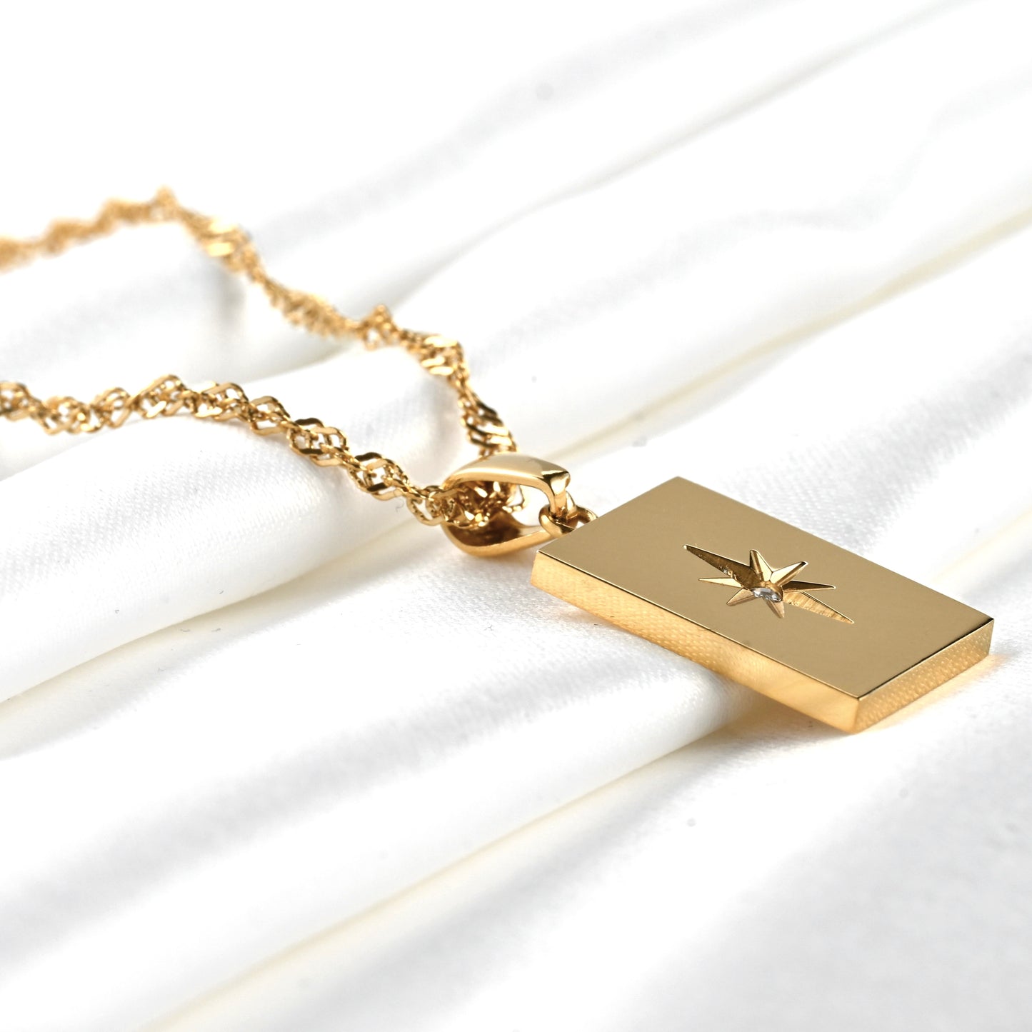 close up view of the tablet pendant with engraved star motif