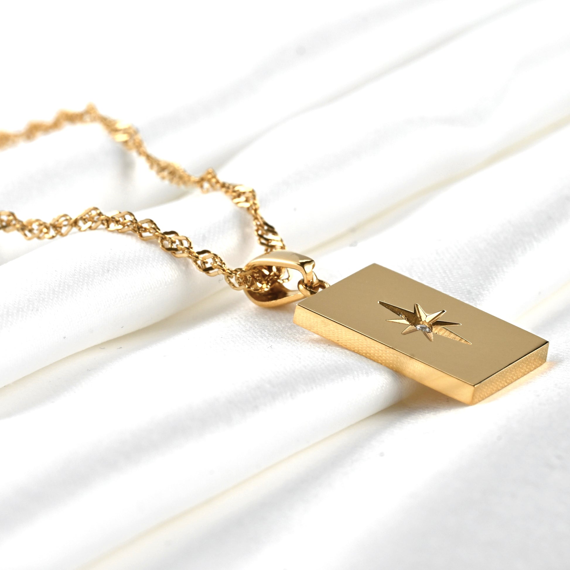 close up view of the tablet pendant with engraved star motif