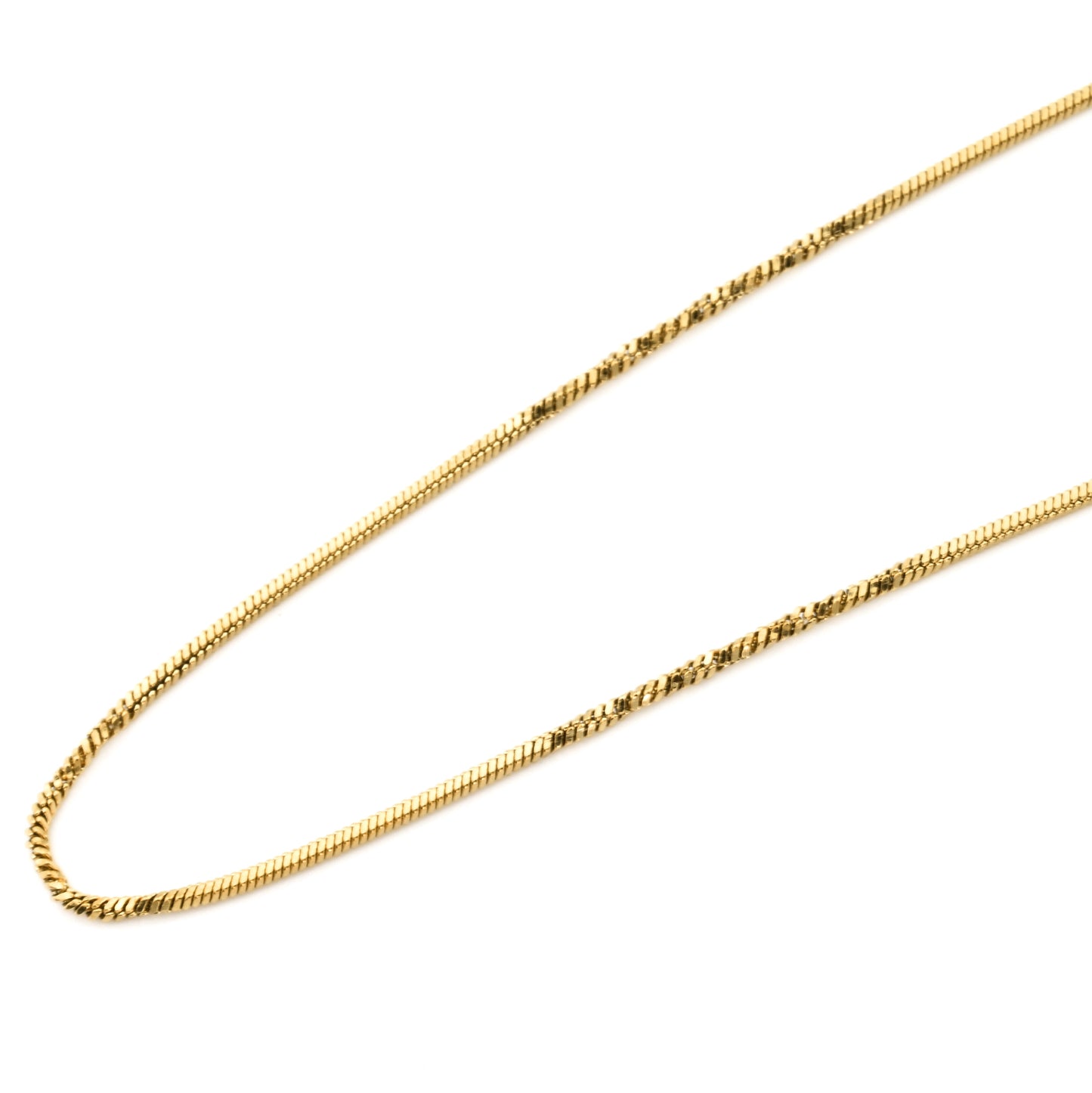 Gold chain necklace with gentle twists on a white background