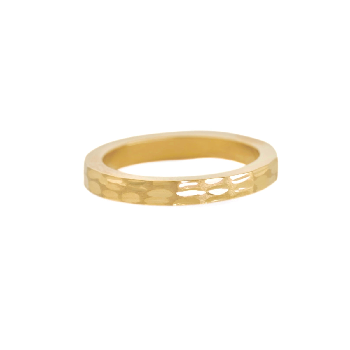 A thin yellow gold band ring with a textured, hammered finish on the front and a polished, smooth interior, shown against a plain white background.