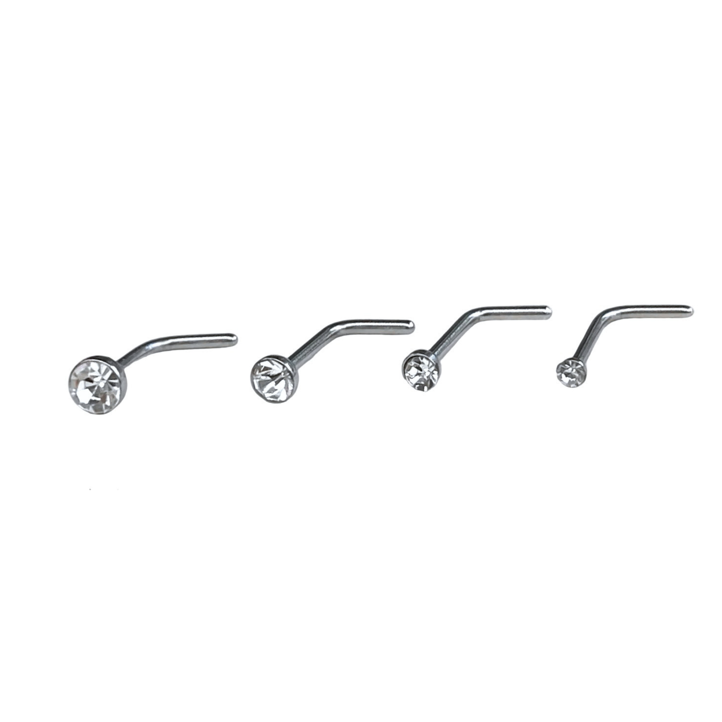Set of four silver nose studs with clear stones positioned big to small (from 3mm to 1.5mm) on a white background