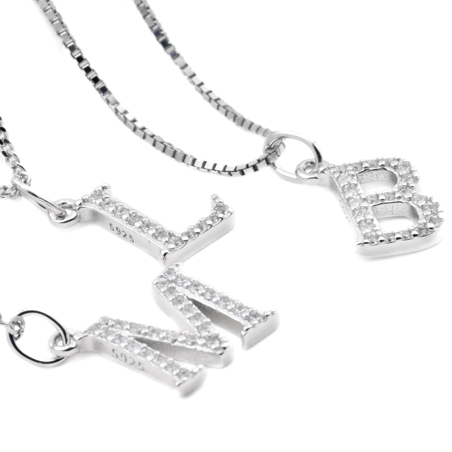 Angled close-up view of silver necklaces