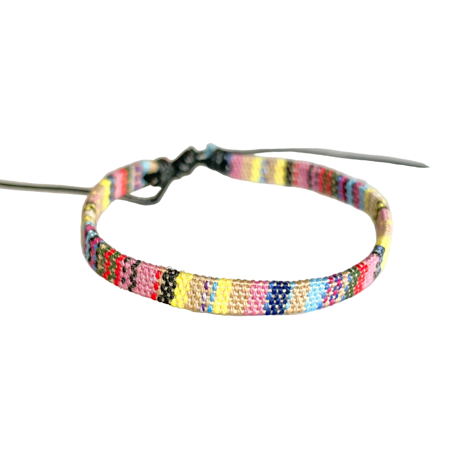 Yellow dominant multicolored handmade ankle bracelet on a white background