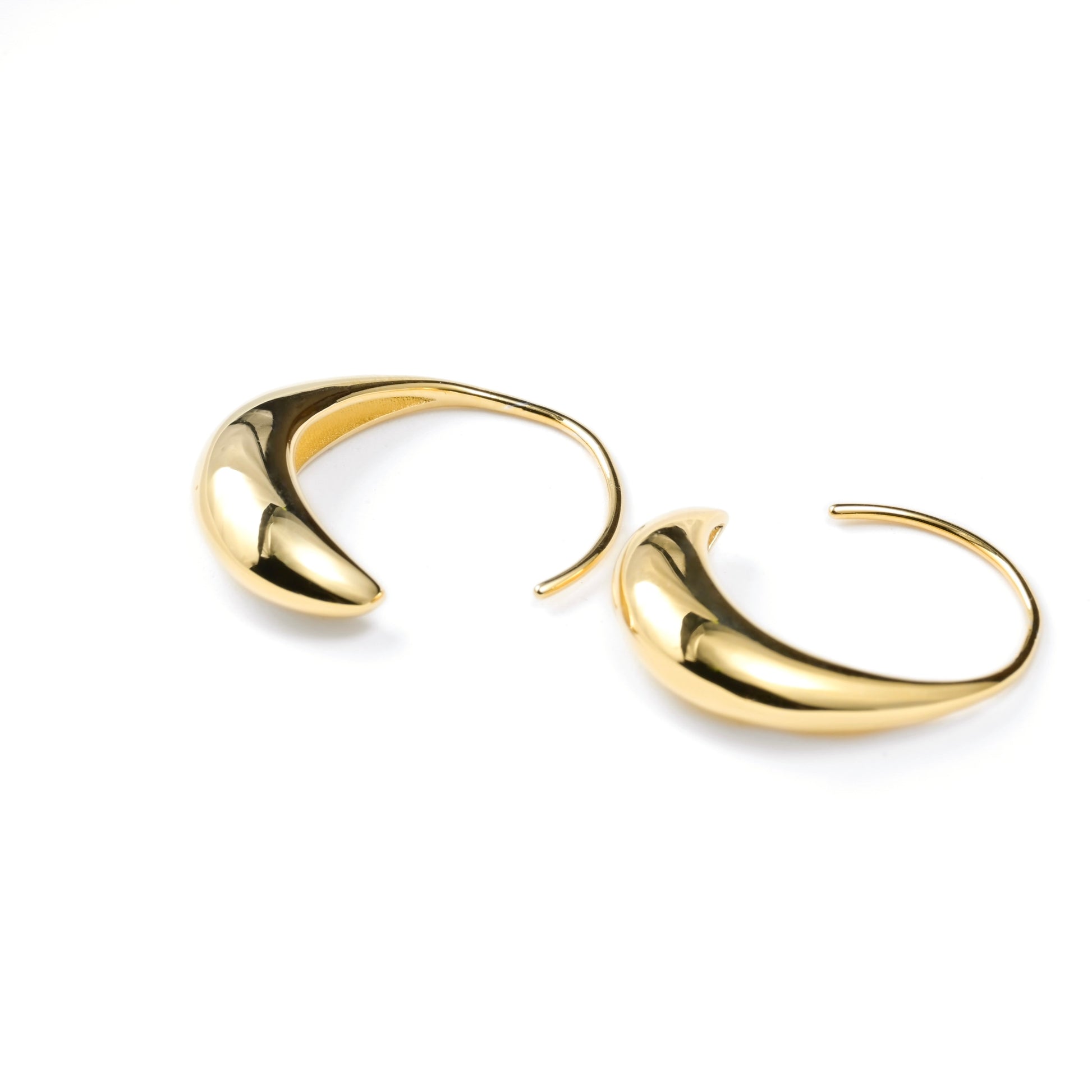 Gold drop hoop earrings  flat on a white background
