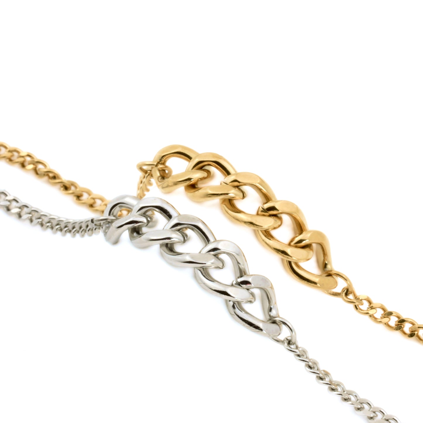 Two gold and silver  mixed chain bracelets on a white background