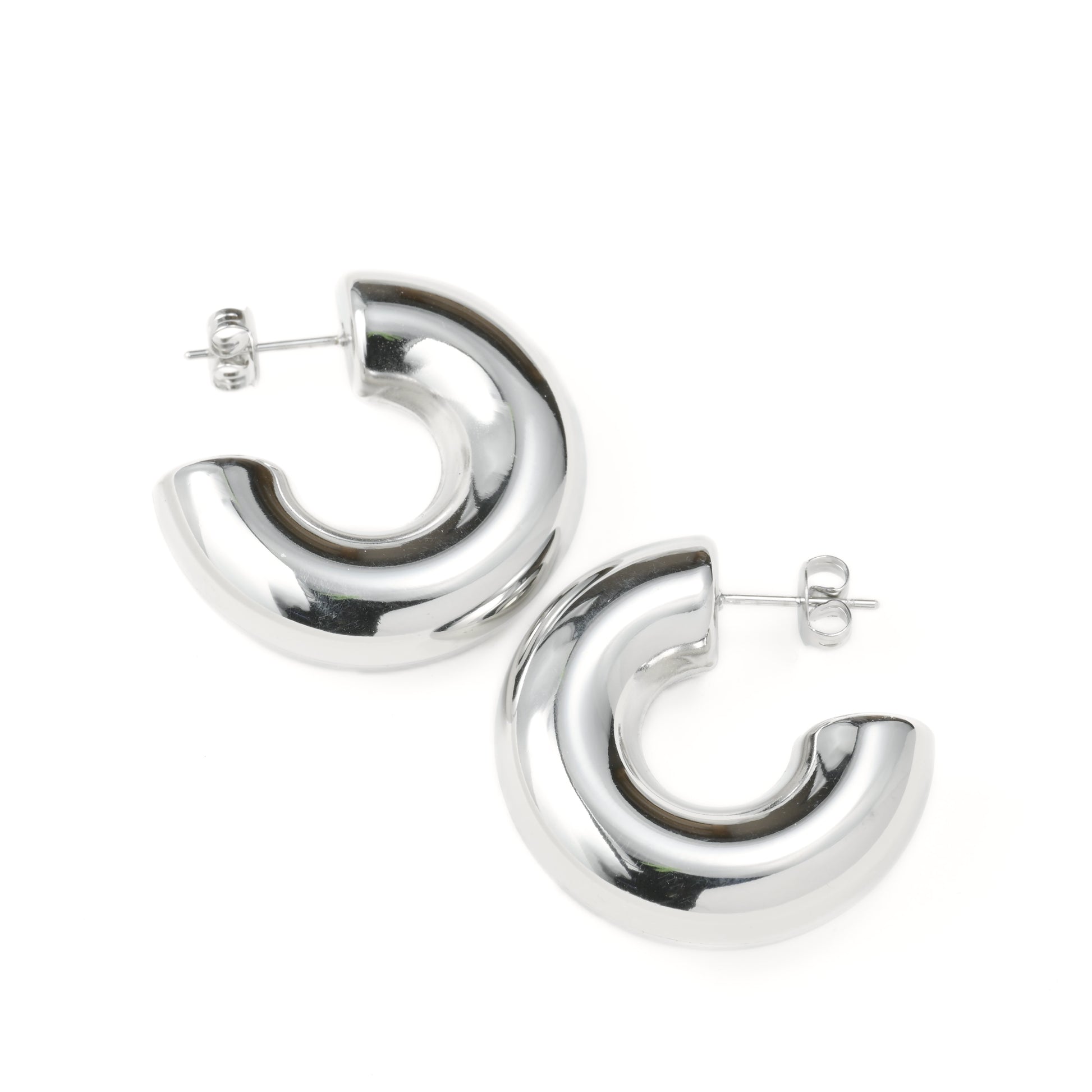 Plain Silver  statement earrings on a white background