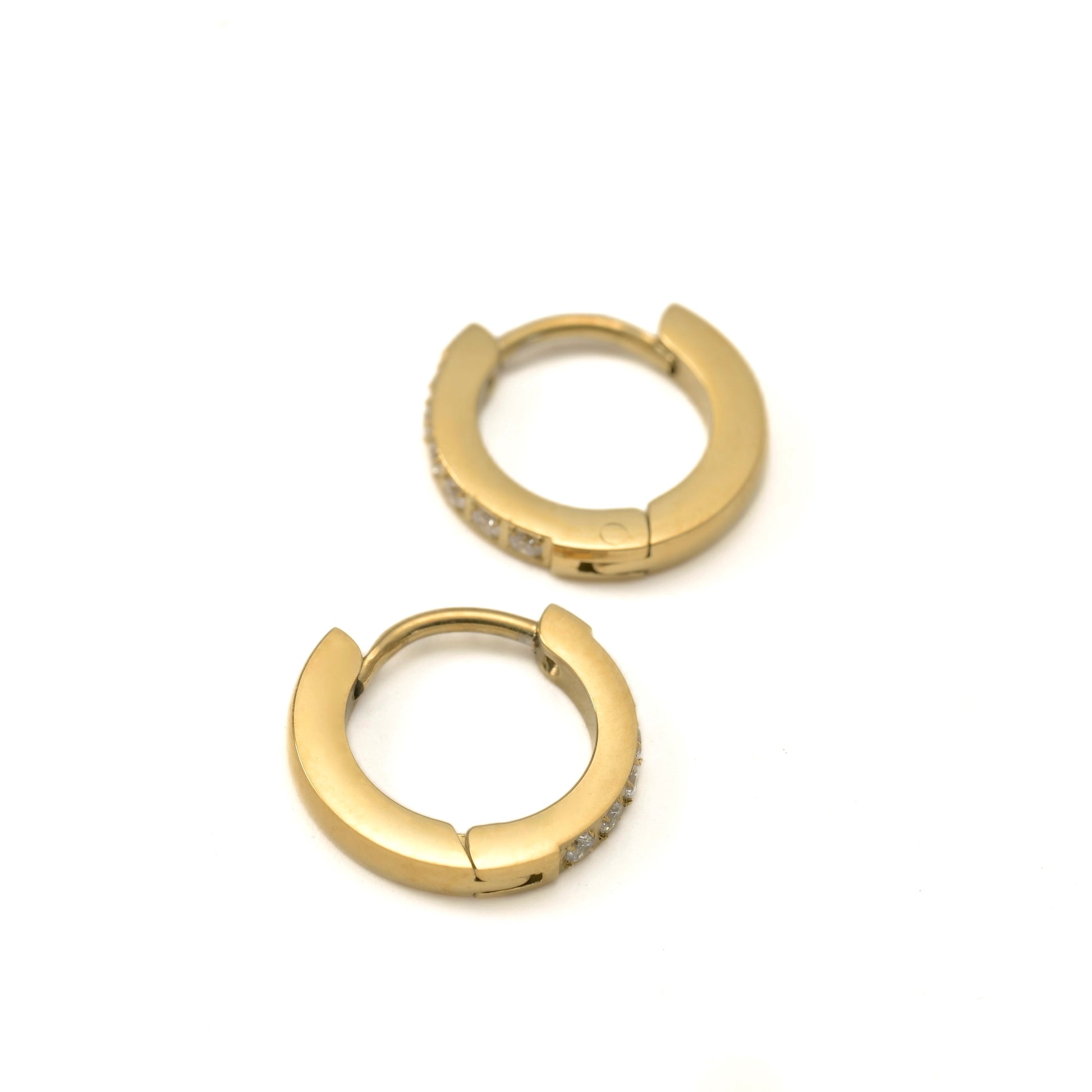 Small Gold hoop earrings with embedded stones on a white background