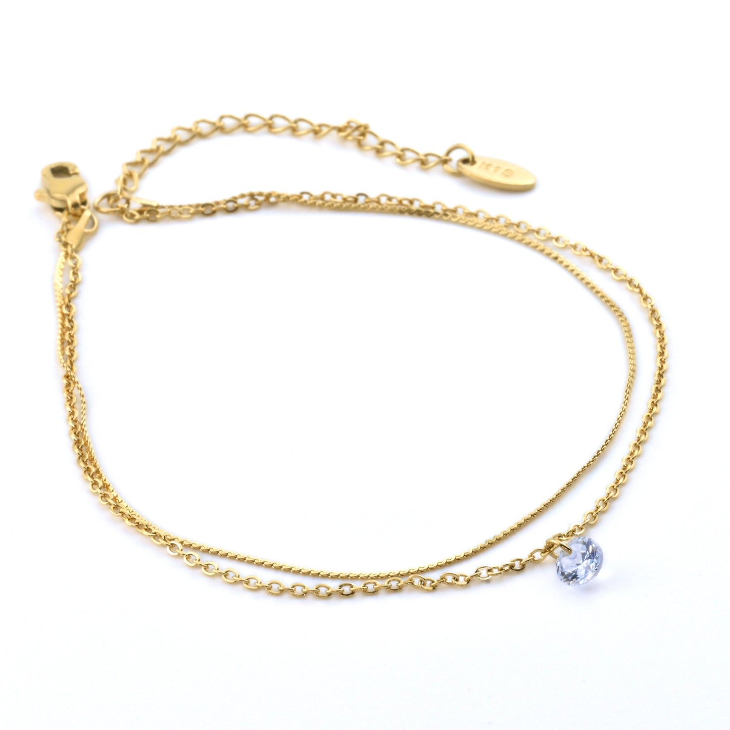 Double layered gold chain anklet set with 'K18' plating tag on a white background