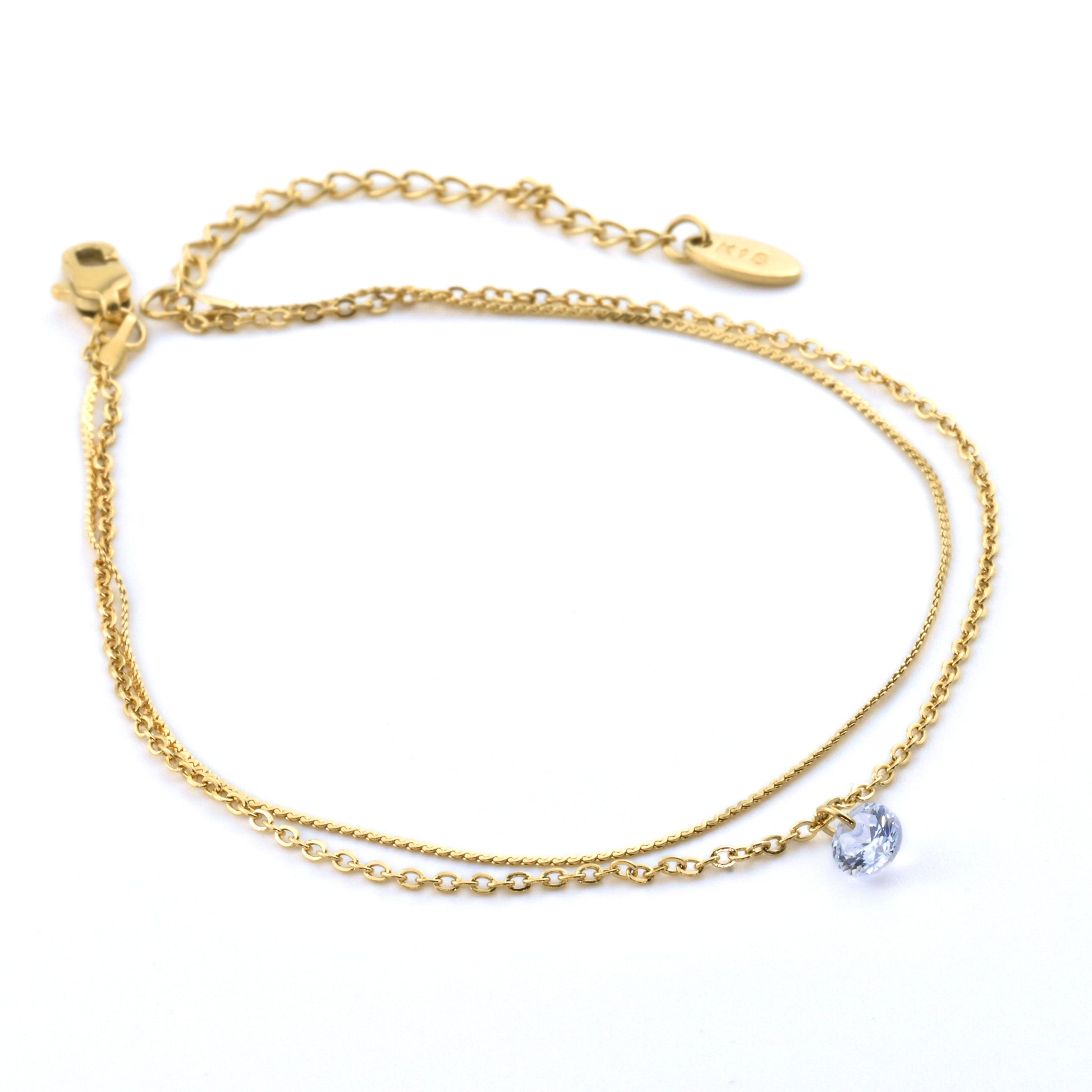 Double layered gold chain anklet set with 'K18' plating tag on a white background