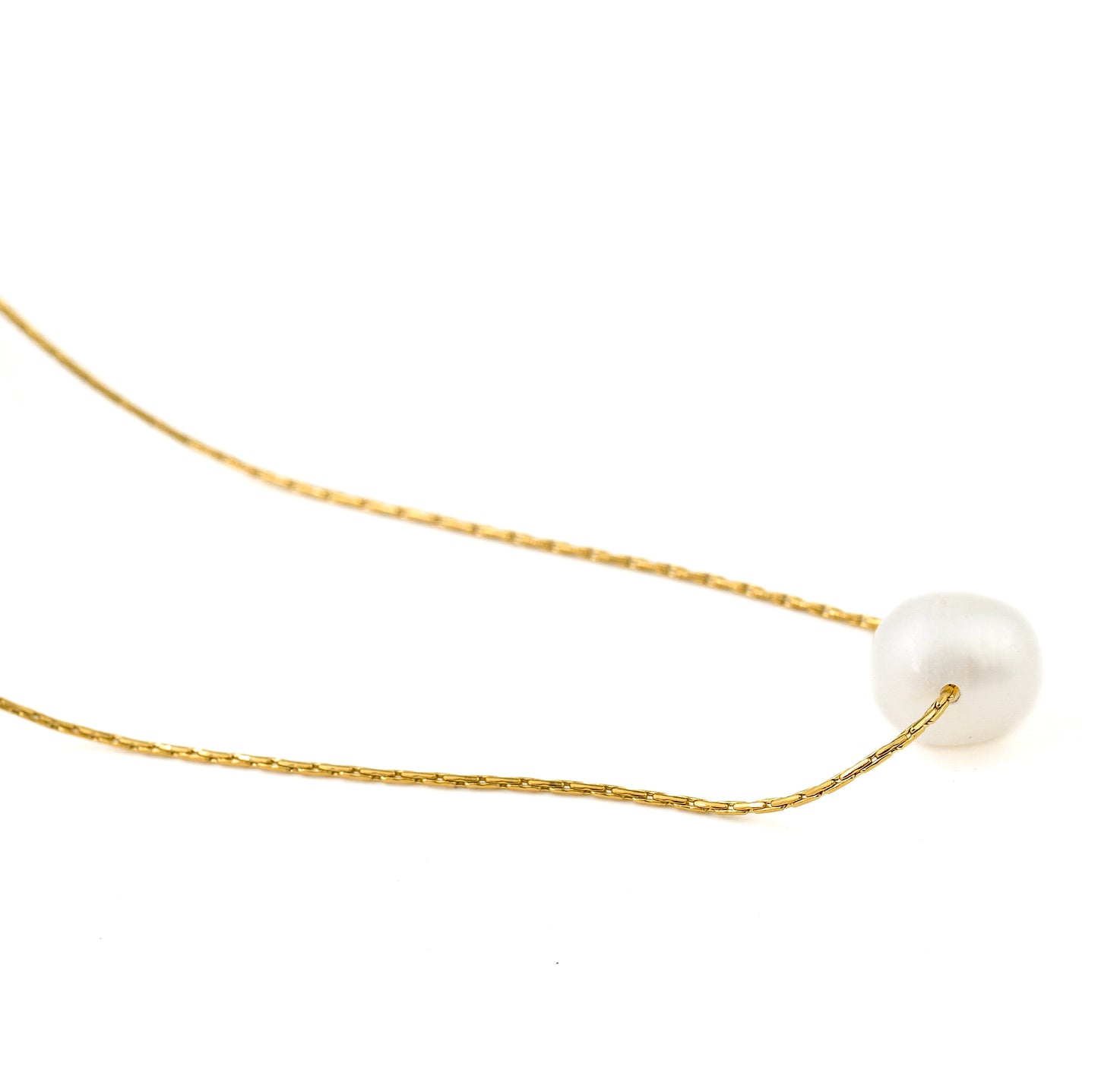 Gold necklace with a single medium  pearl on a white background