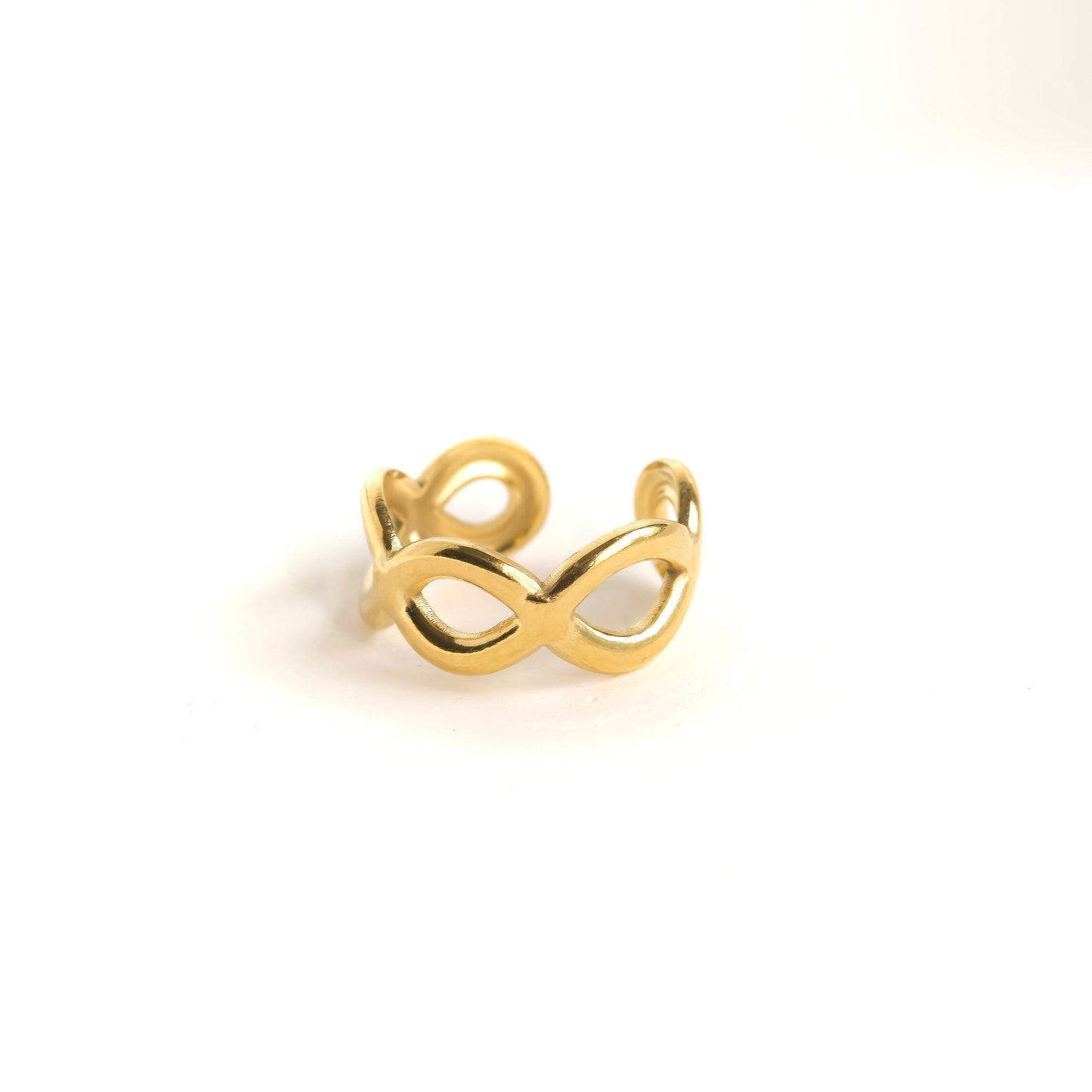 Gold chain link ear cuff on a white background