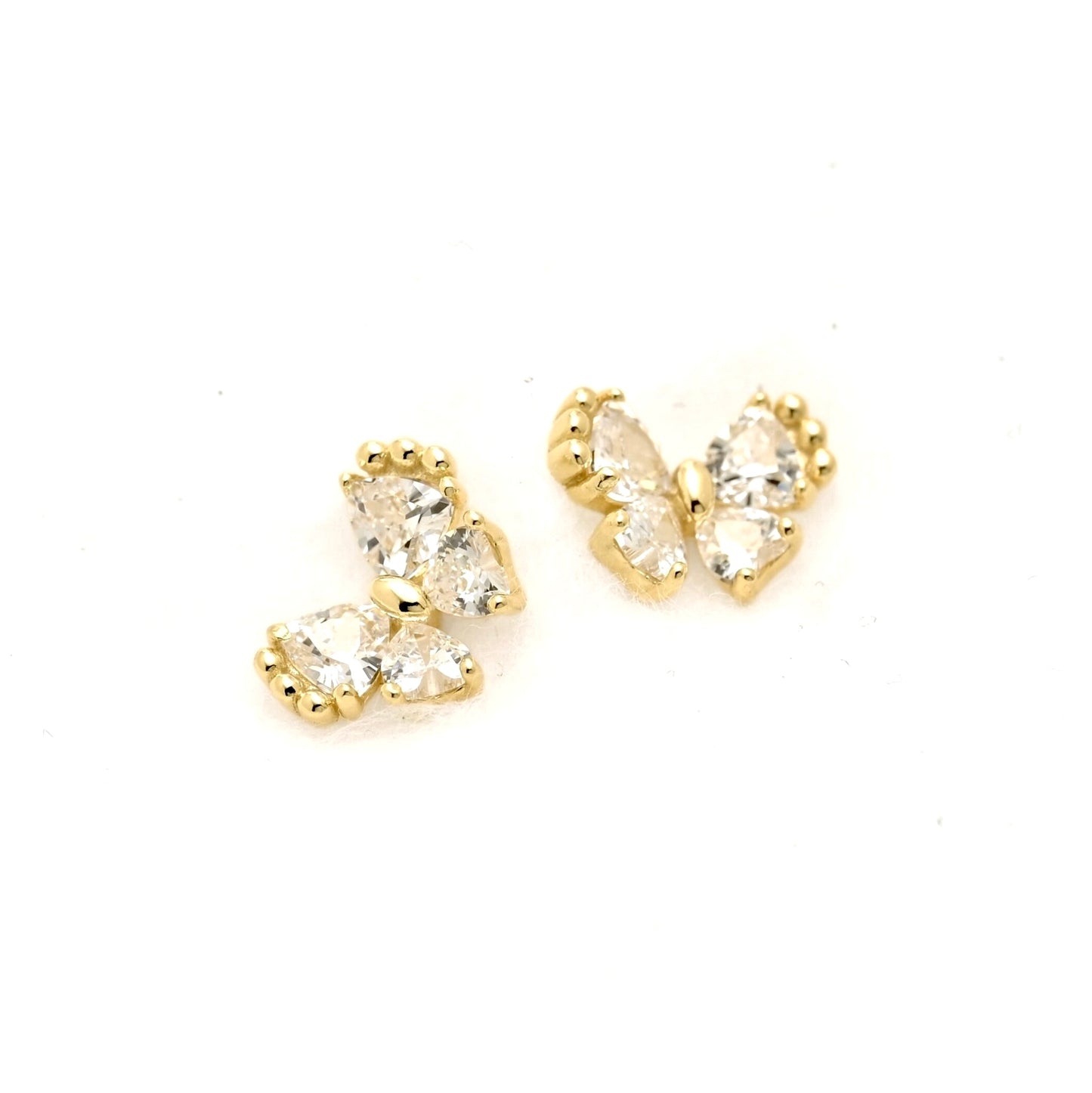 A pair of gold butterfly stud earrings with clear trillion-cut gemstones, displayed on a clean white background.