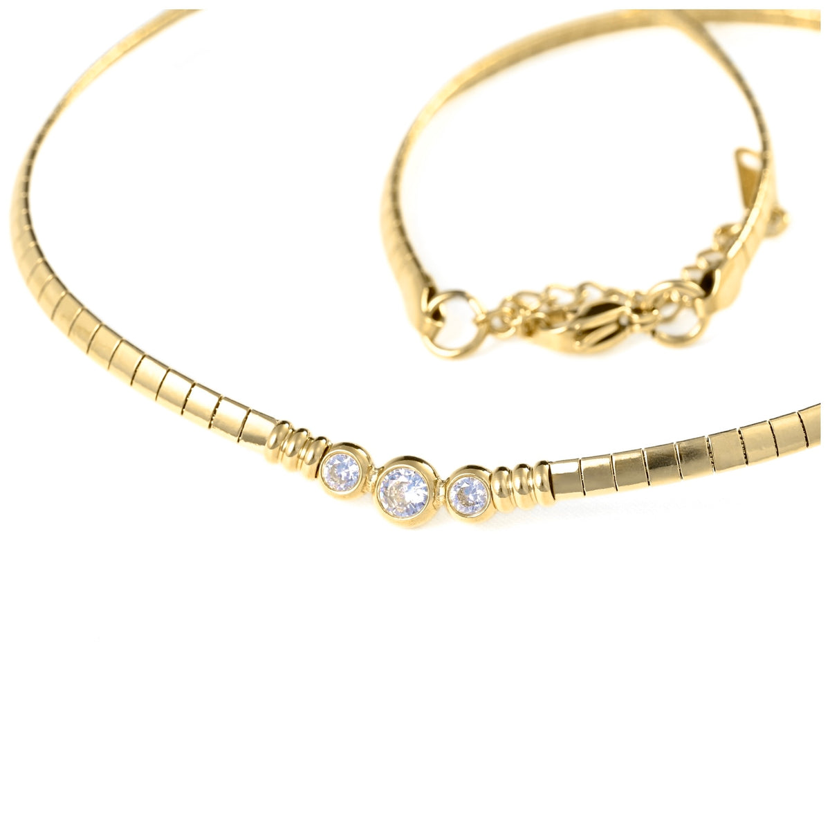 A gold chain bracelet with three small round clear gemstones set in a row, shown on a plain white background with the clasp end visible in the upper right.
