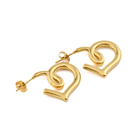 Gold heart earrings on a white background